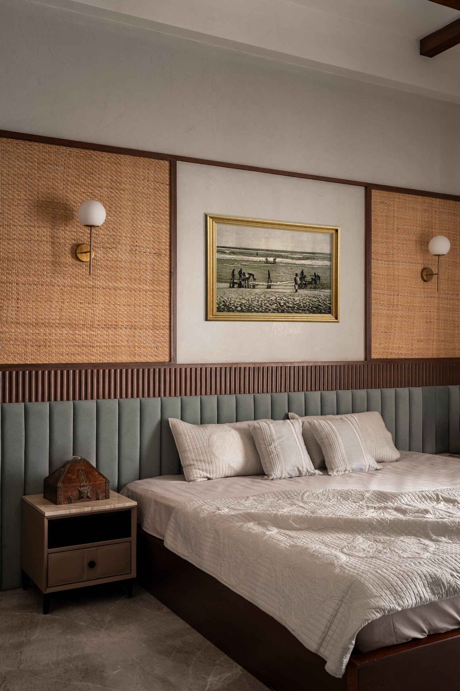 In a second bedroom, woven cane panels and fluted wood arrange themselves in successive horizontal bands