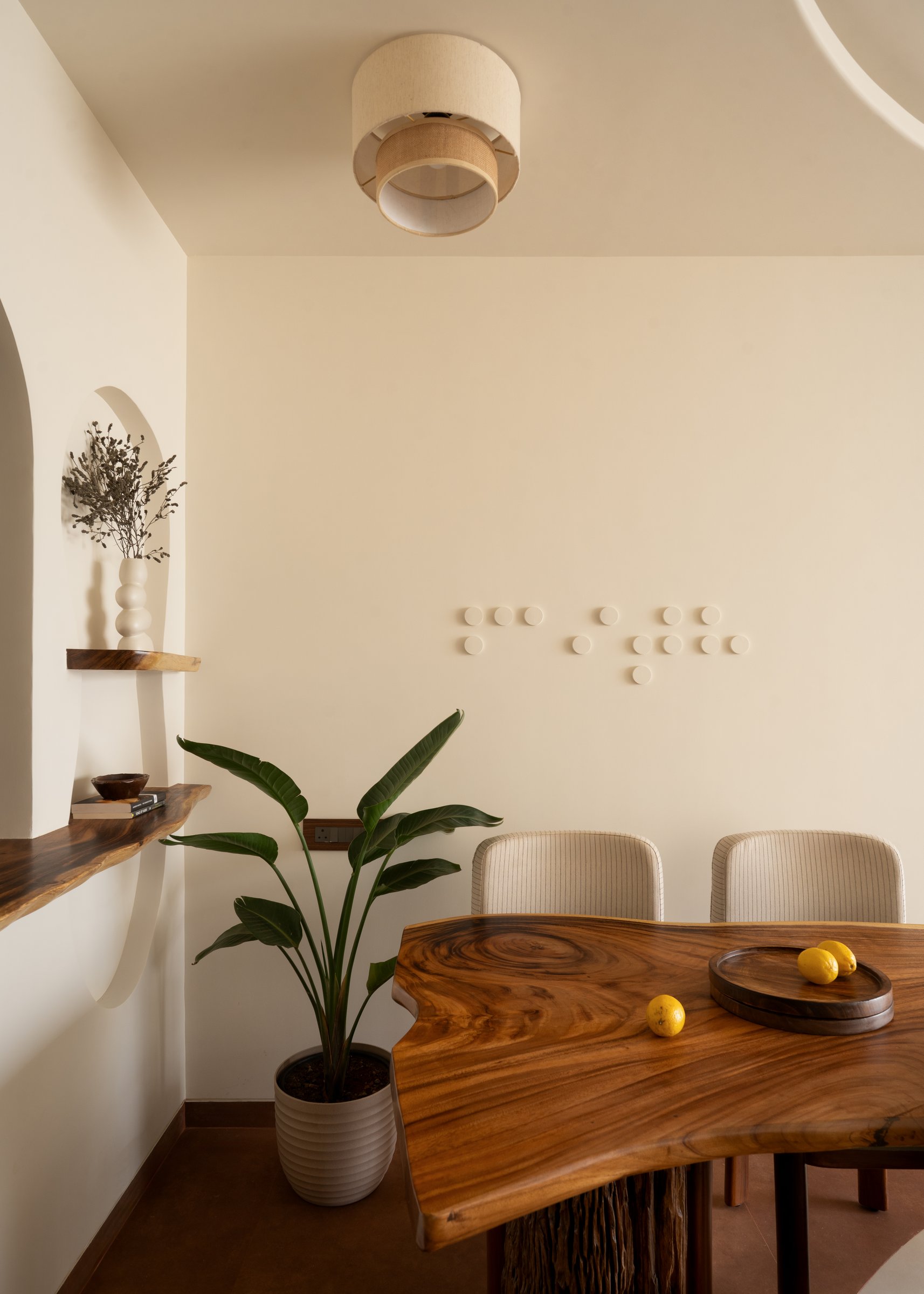 Ceramic discs arranged in the cadence of braille, the dining area's one piece of overt wall art