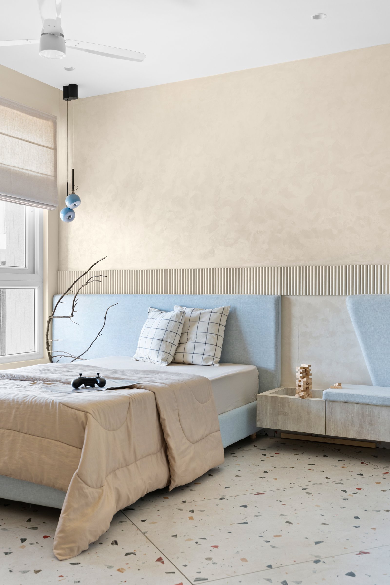 The first children's bedroom, where powder blue and terrazzo do most of the talking