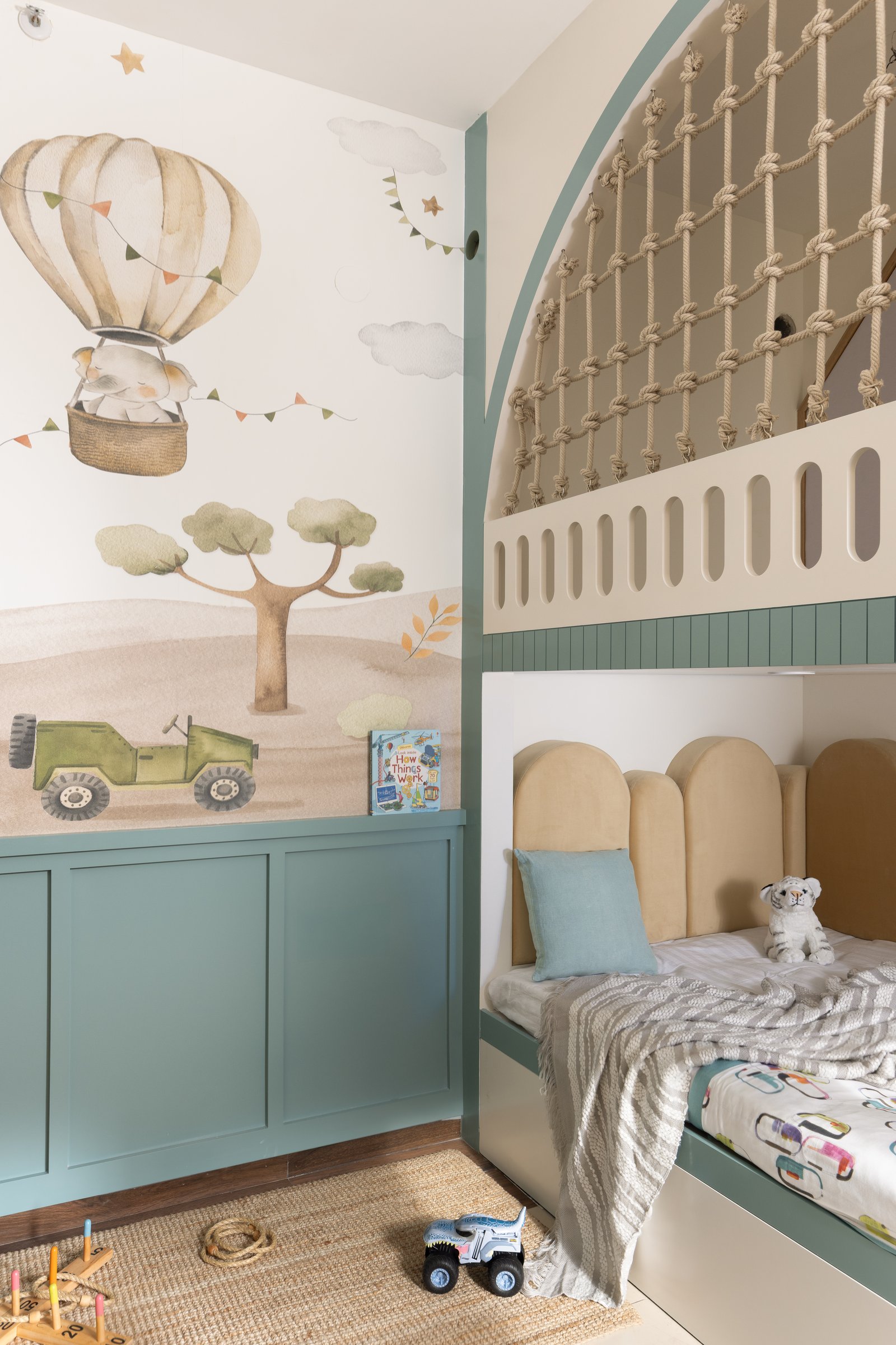 The children's room, where a watercolour mural and a built-in bunk bed read as small architecture rather than furniture