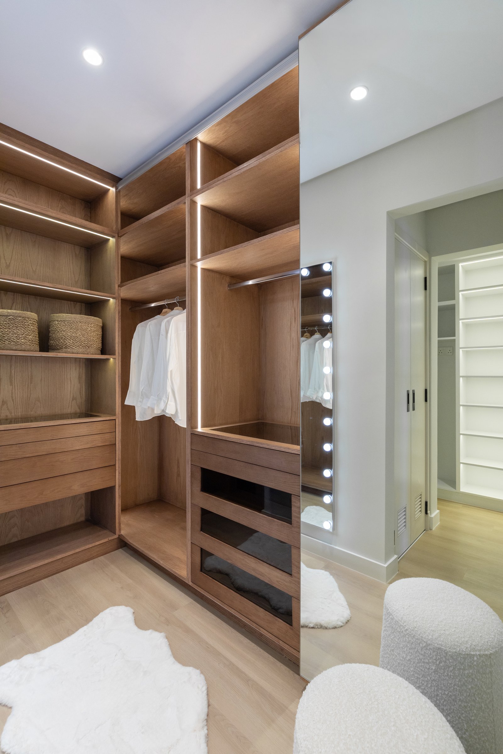 The walk-in dressing room, where the apartment's joinery work shows its full hand