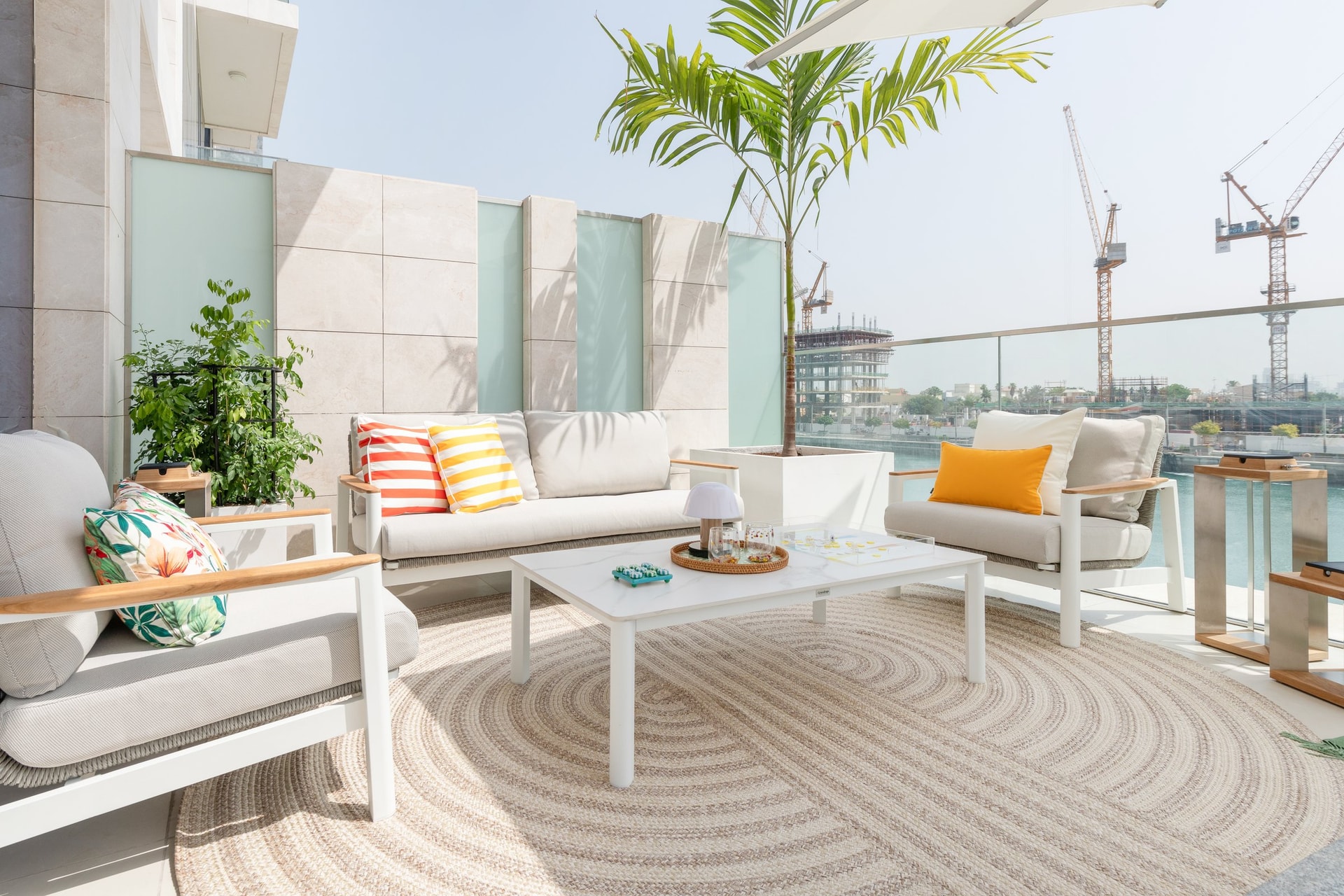 Striped cushions on the terrace lounge, the one place in the home where colour behaves loosely