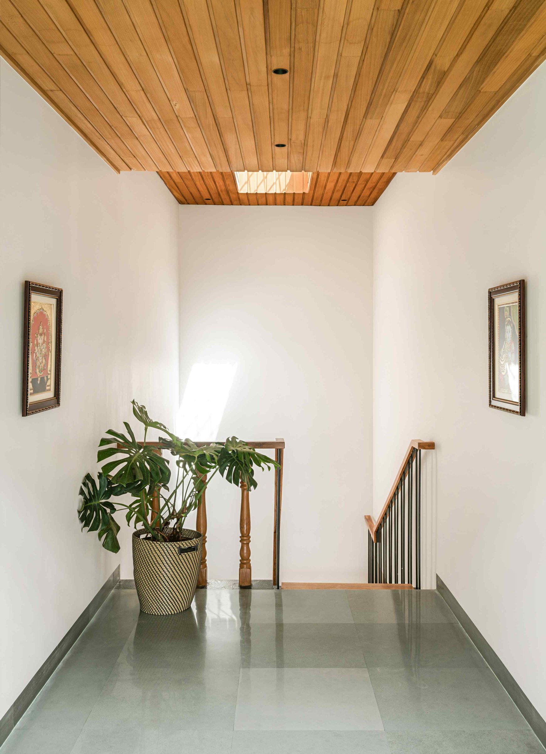 The upper landing, where restraint and a single recessed skylight do most of the work