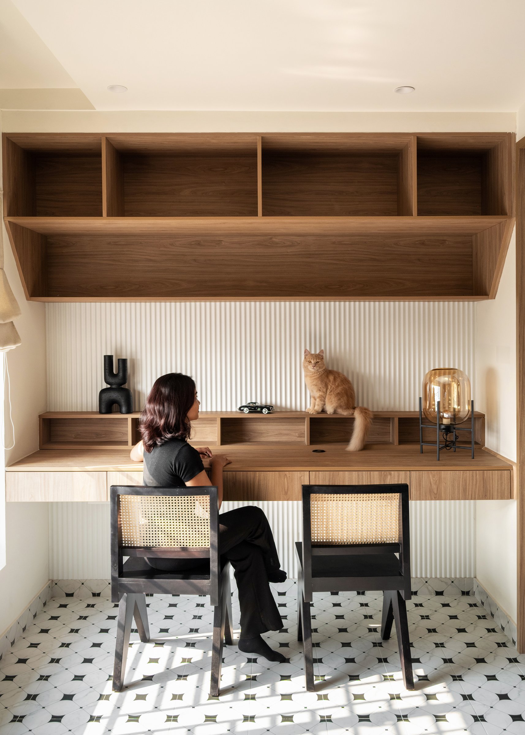 Reconfigured for focused work: a fluted backsplash and a desk built for two