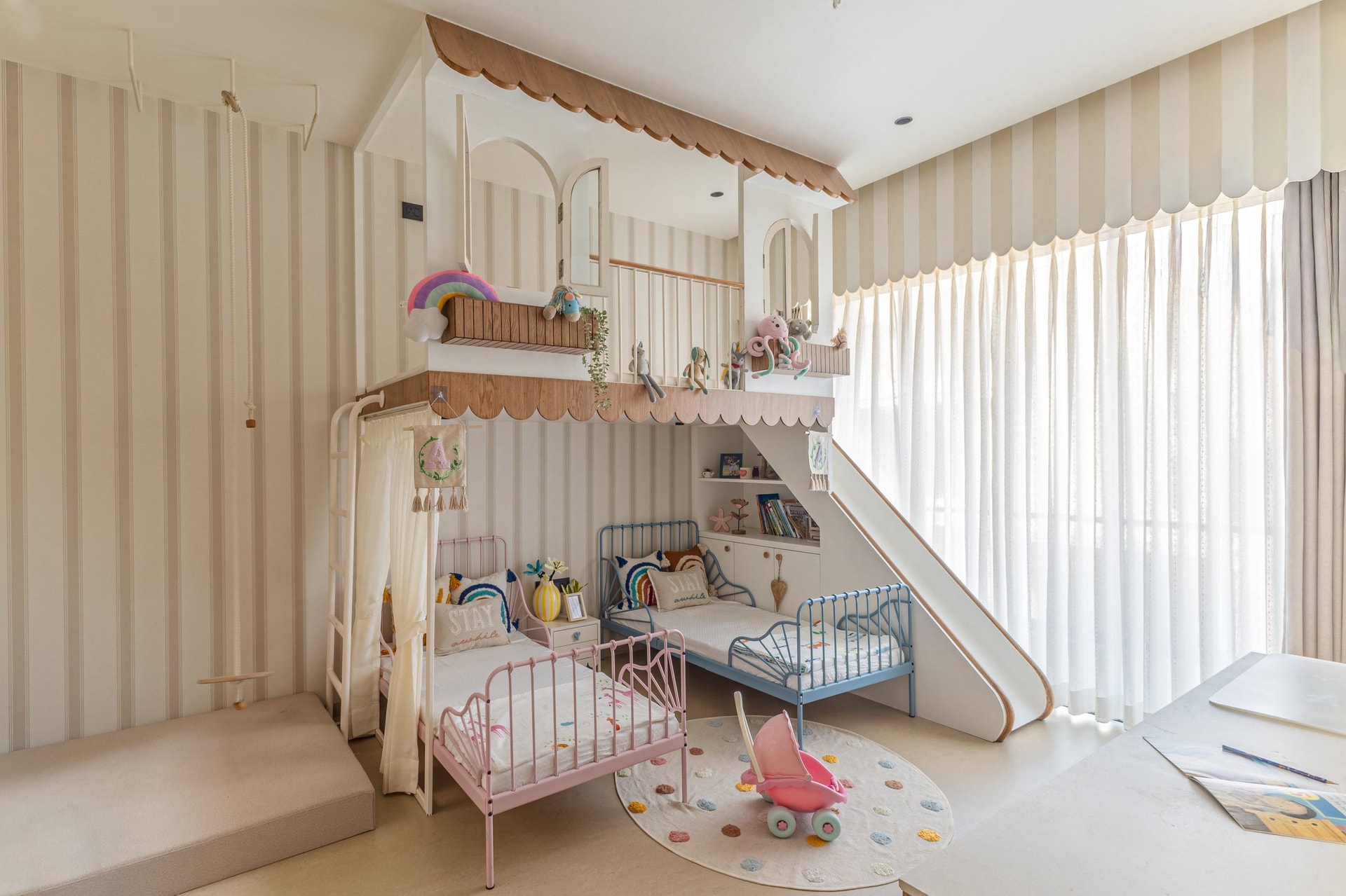 The children's room, where a scalloped loft above metal-framed beds plays at being a treehouse