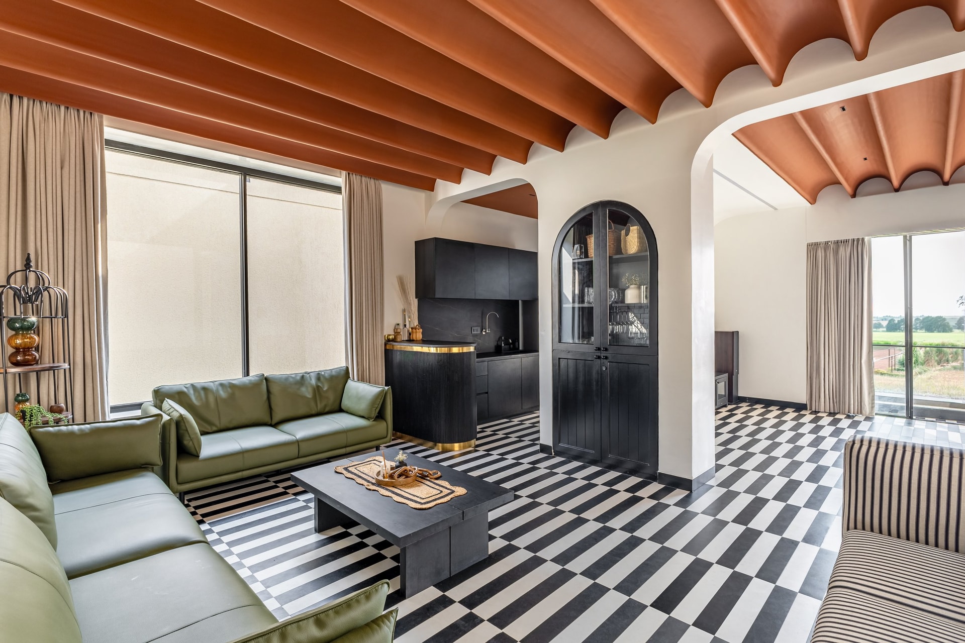 The entertainment volume, a deliberate foil to the rest of the home: scalloped apricot vaults and a checkerboard floor