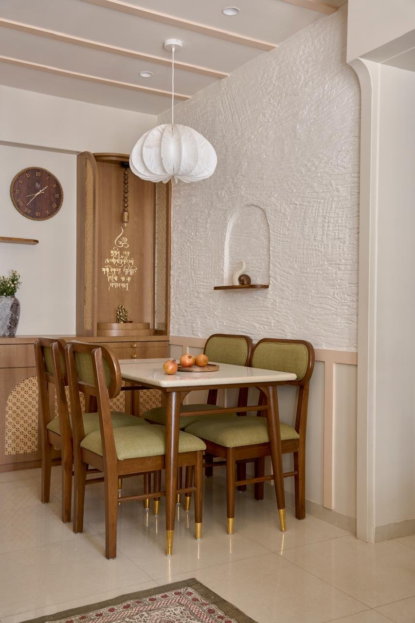 The dining area, where a softly crumpled paper pendant from Fig Living reads as a contemporary lantern above a stone-topped table