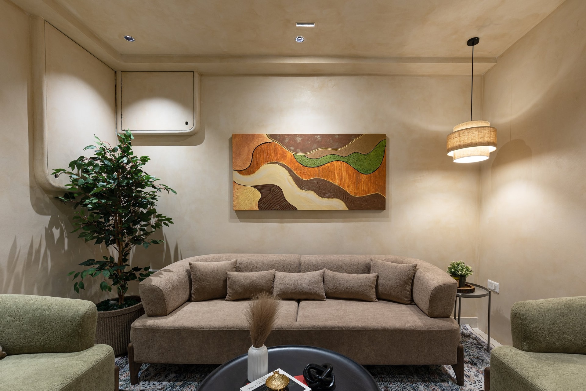 The formal living room, where an earth-toned abstract canvas gathers the home's full palette into a single frame