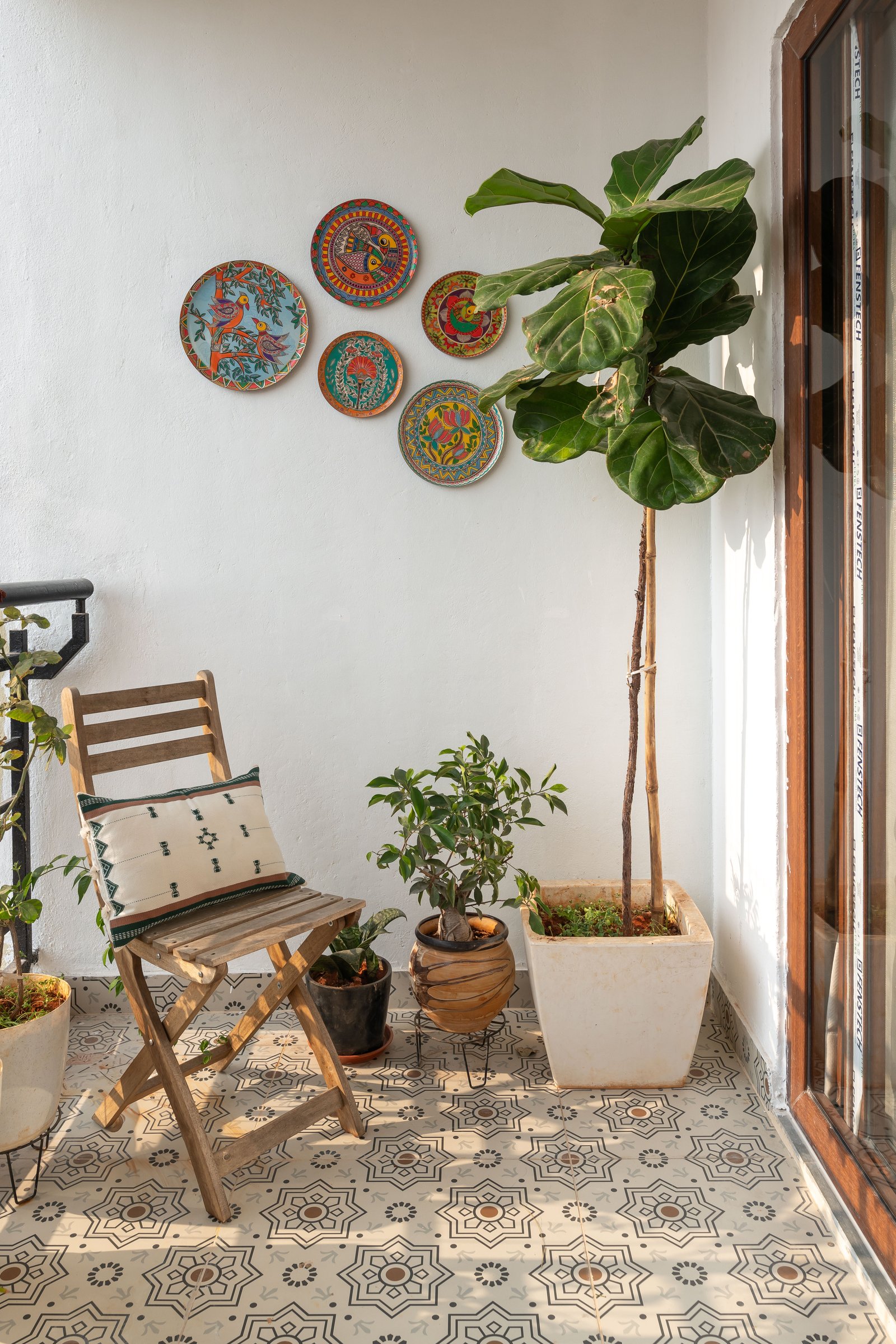 The balcony, where the home's folk vocabulary surfaces in its most relaxed form