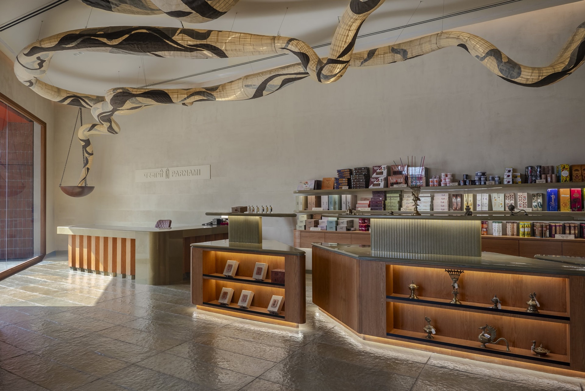 Low-height display islands lit from within keep sightlines open across the compact retail floor
