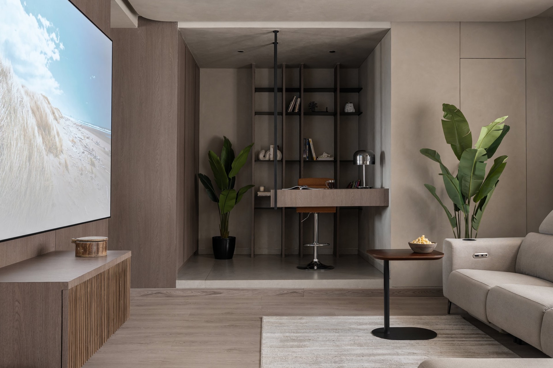 The home theatre and study alcove behind the living room, raised on a platform with its own change in flooring