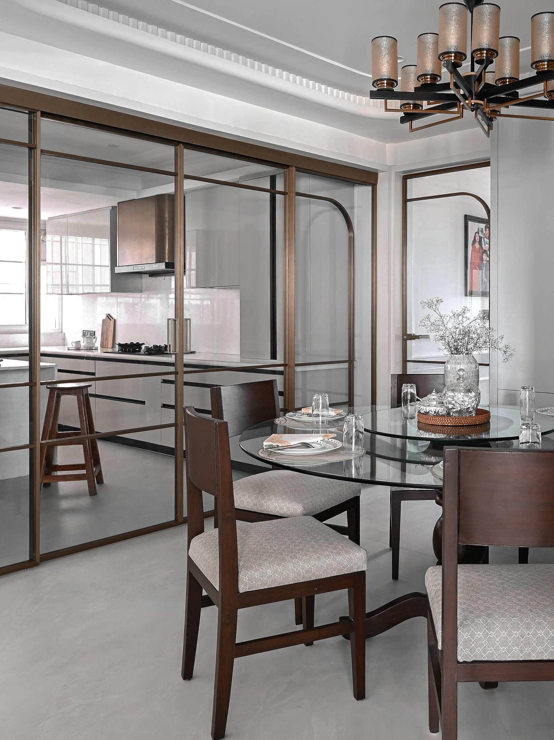 From the dining side, the kitchen breathes visually into the home without surrendering its working identity