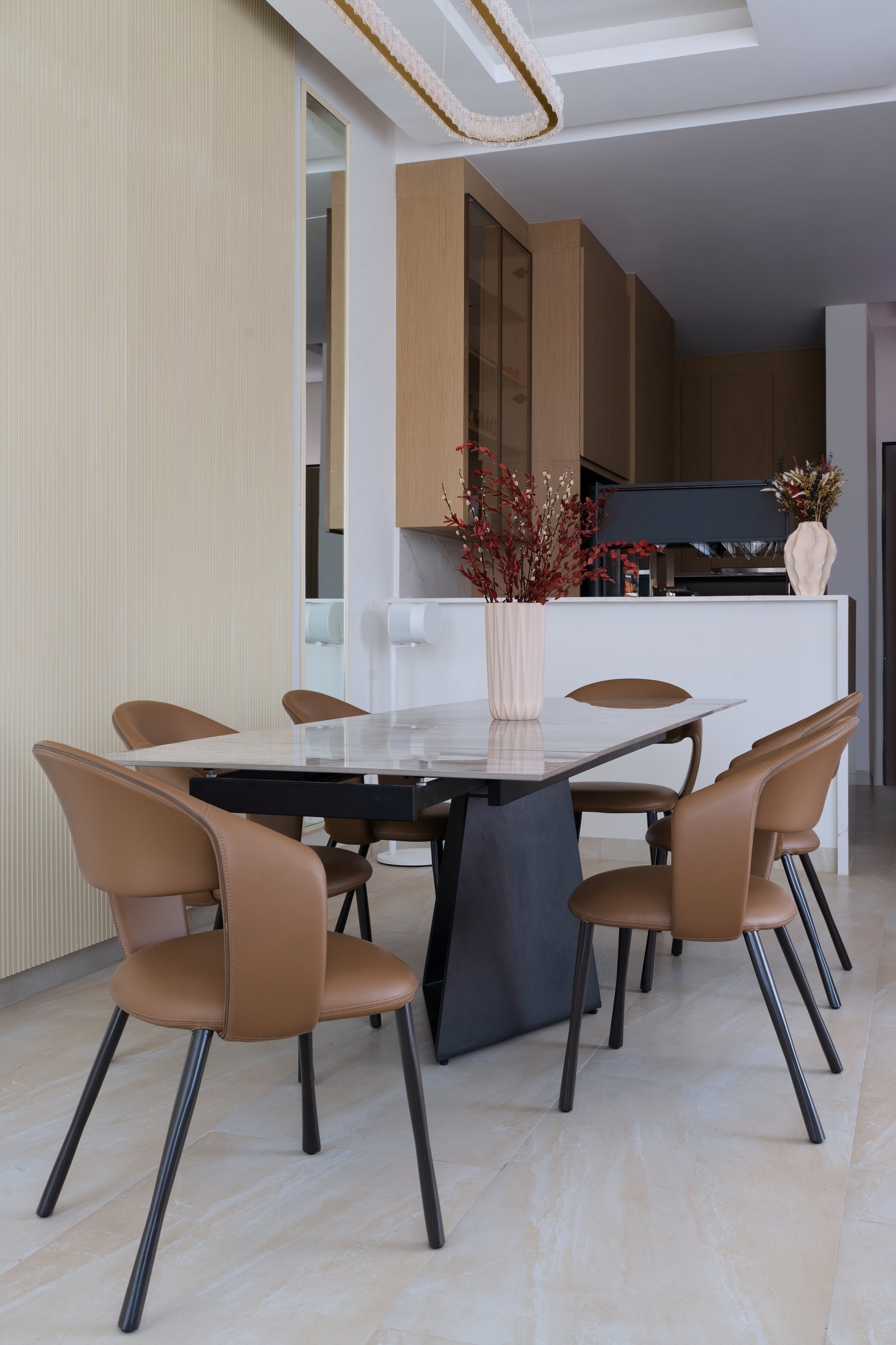 The dining area, separated from the open kitchen by a low counter that doubles as a service edge