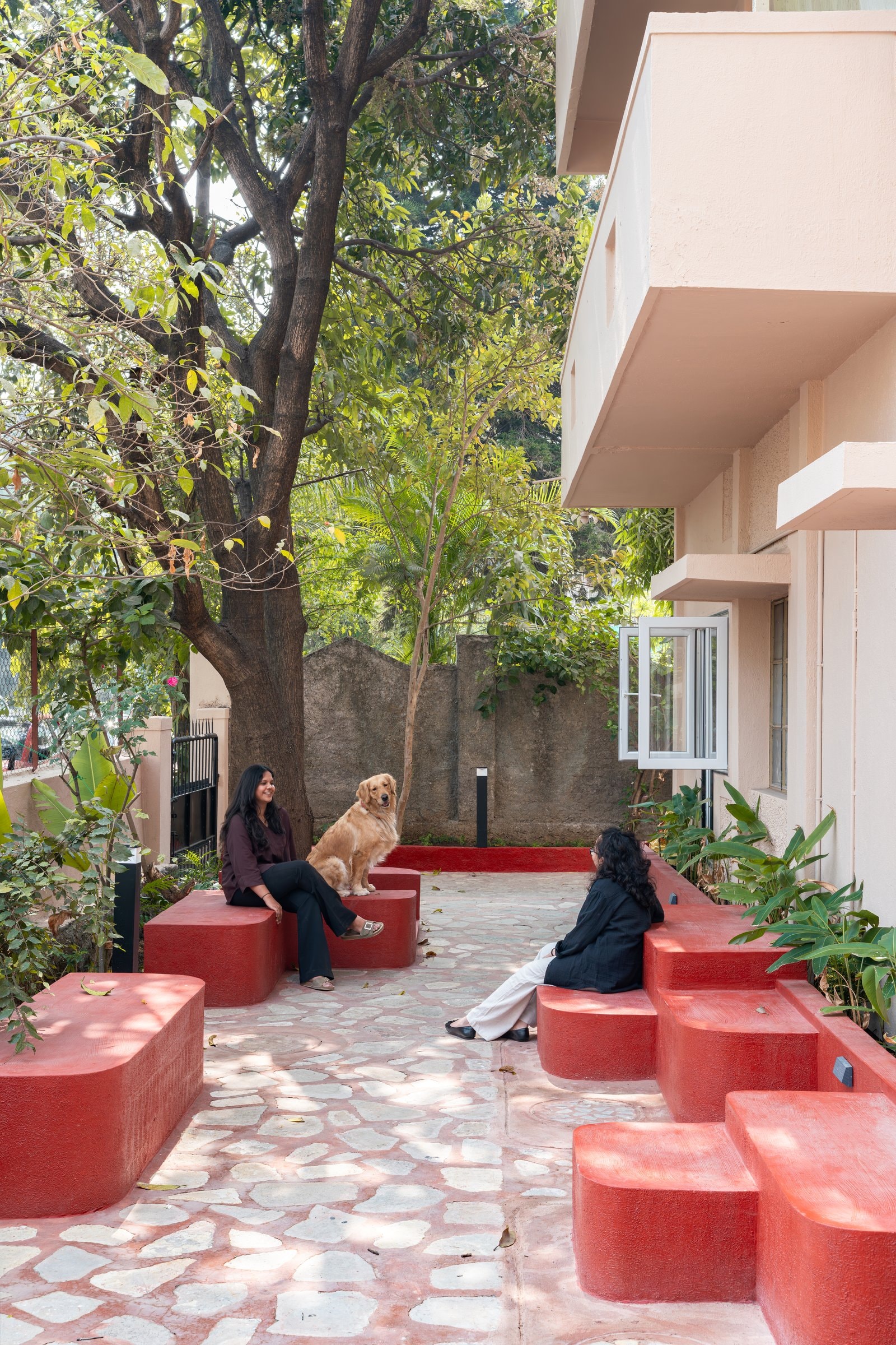 The entry threshold, where the pivoting door opens onto the project's continuous volume