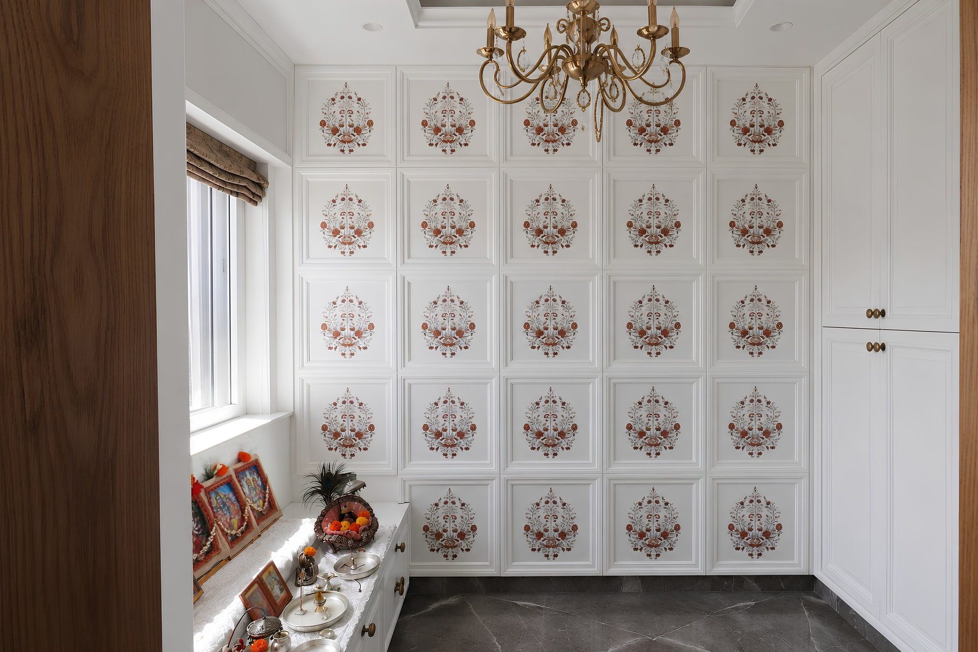 The puja room, where a grid of panels carries delicate floral motifs in coral and sage