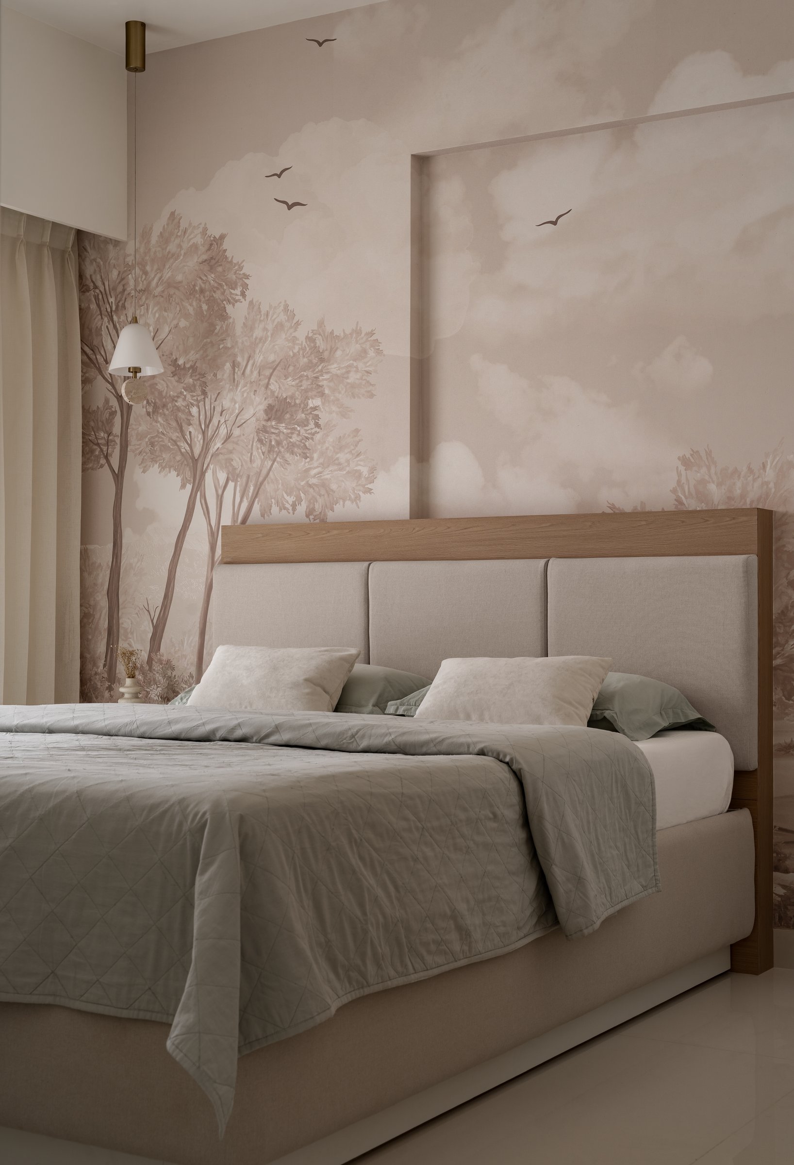 The bedroom, where a sepia forest mural deepens the room's perceived horizon behind a tall upholstered headboard