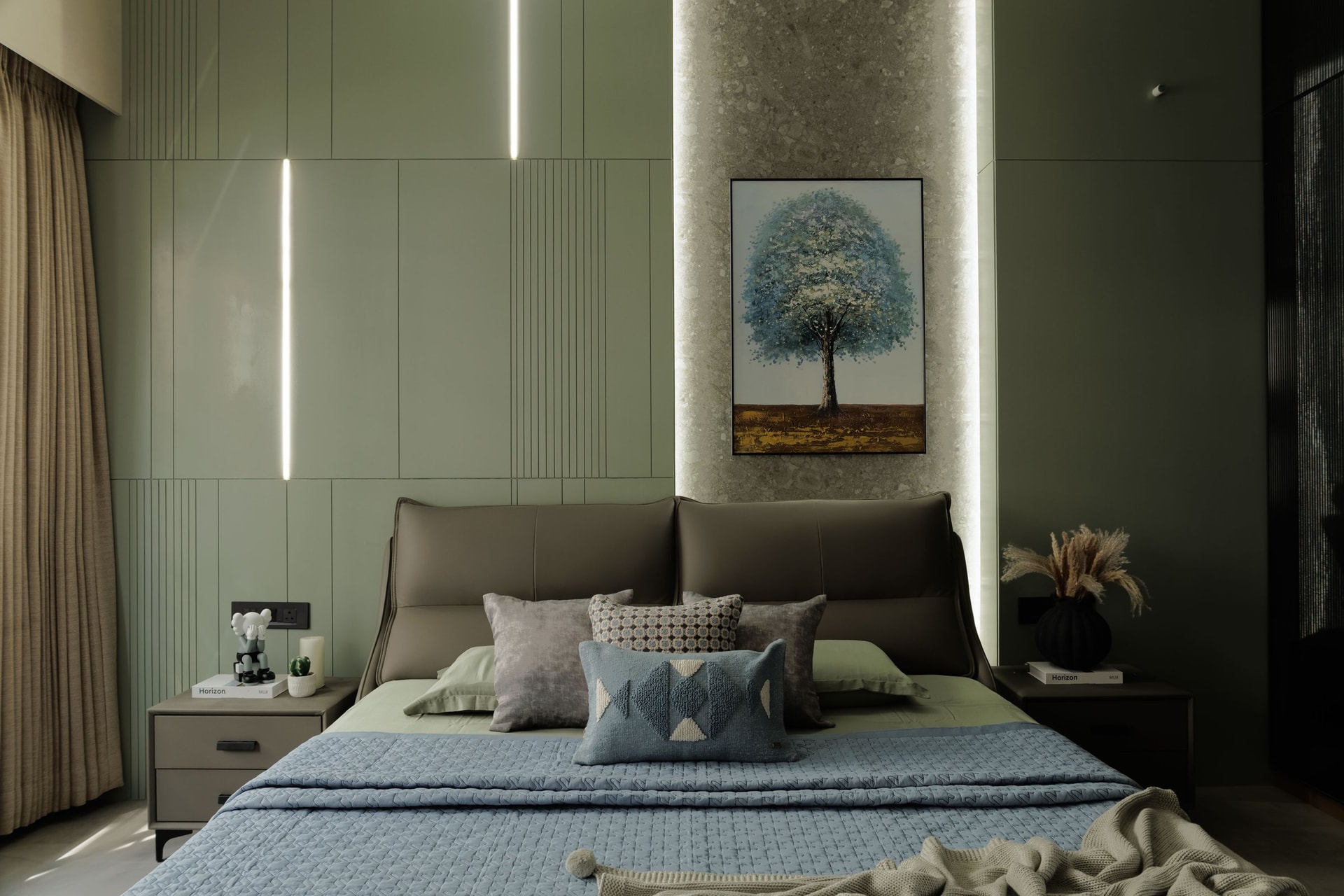 A third bedroom anchored by a sage panelled headboard wall scored with vertical reveals and linear LEDs