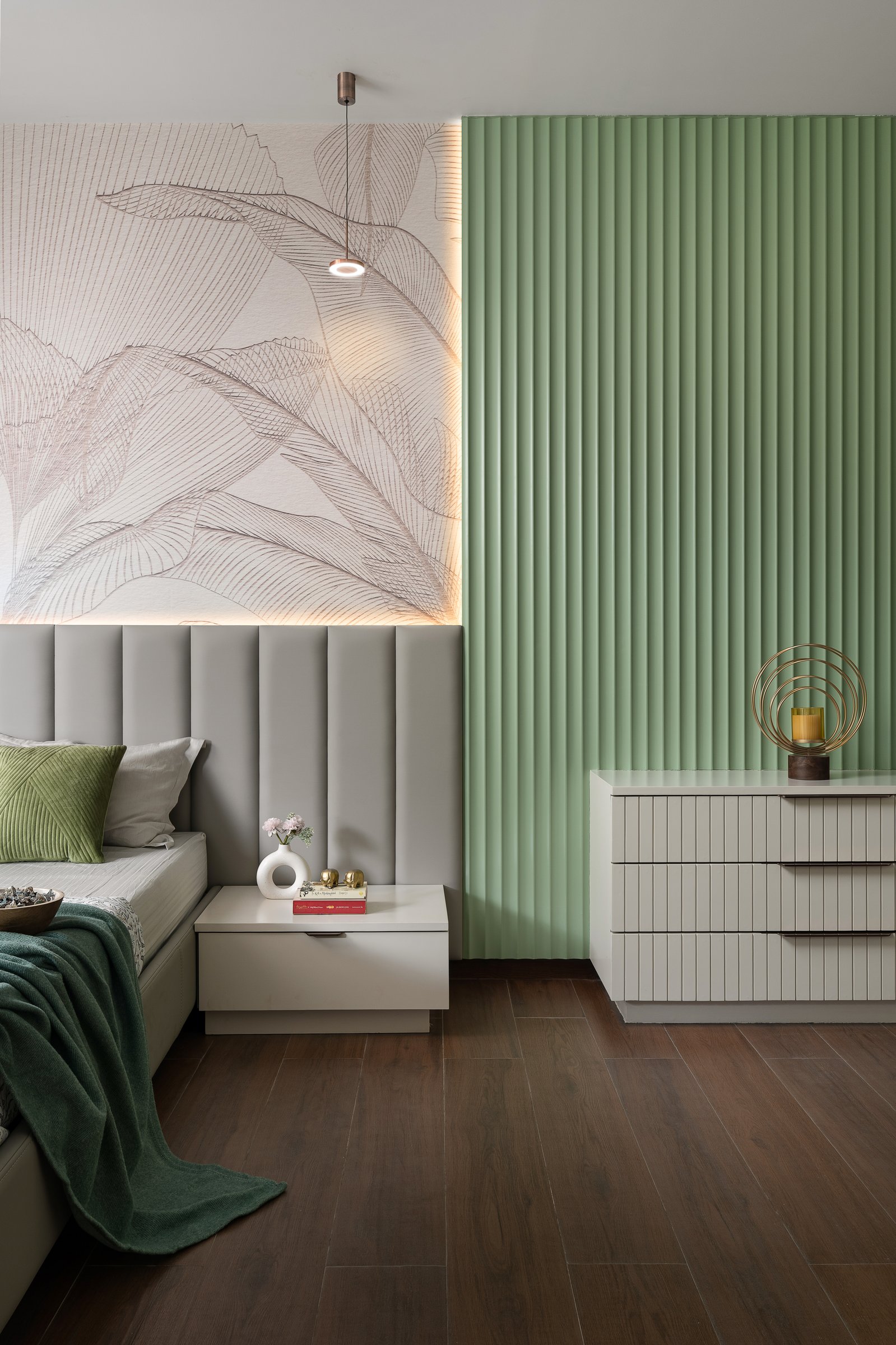 A closer view of the same room, calibrated around vertical motion across mural, headboard, and fluting