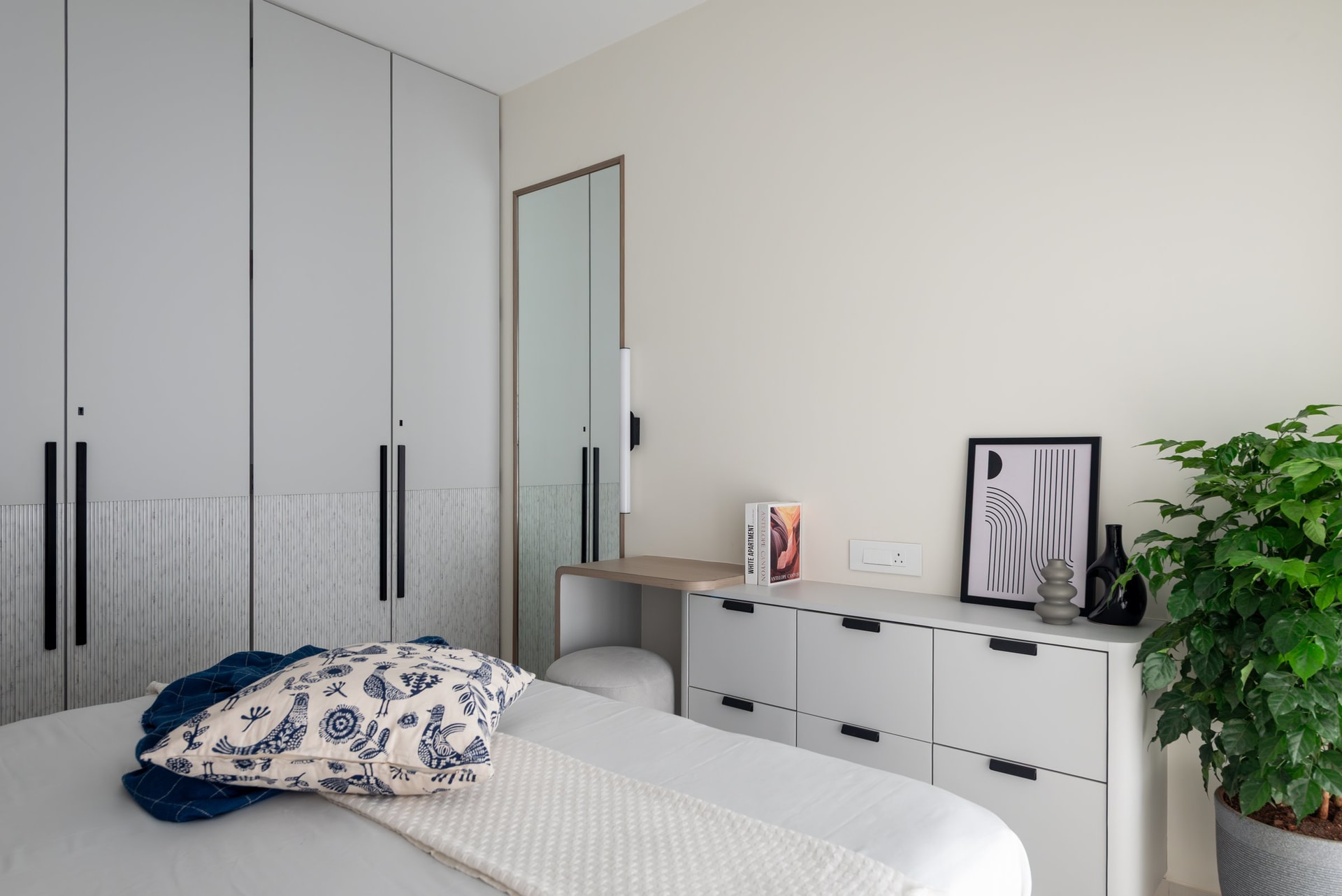 The puja room, approached through a frosted glass partition lined with brass bells