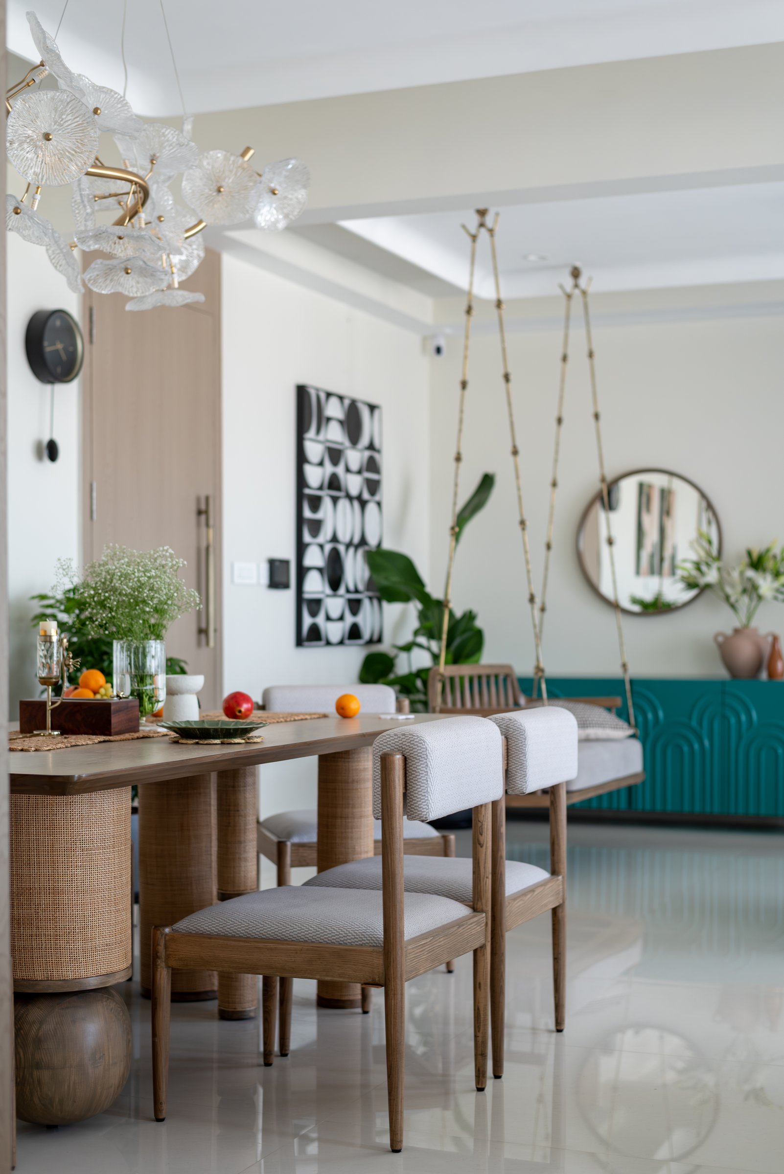 The dining area, where cane-wrapped table bases lend the room its tactile intimacy