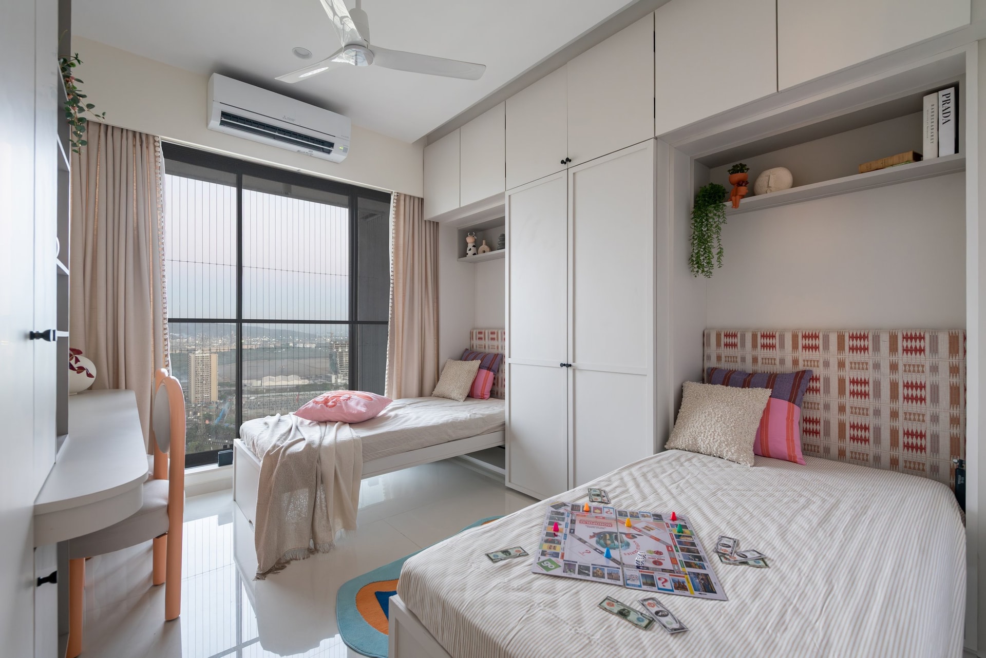 The children's bedroom, where a patterned woven headboard provides the room's only graphic note