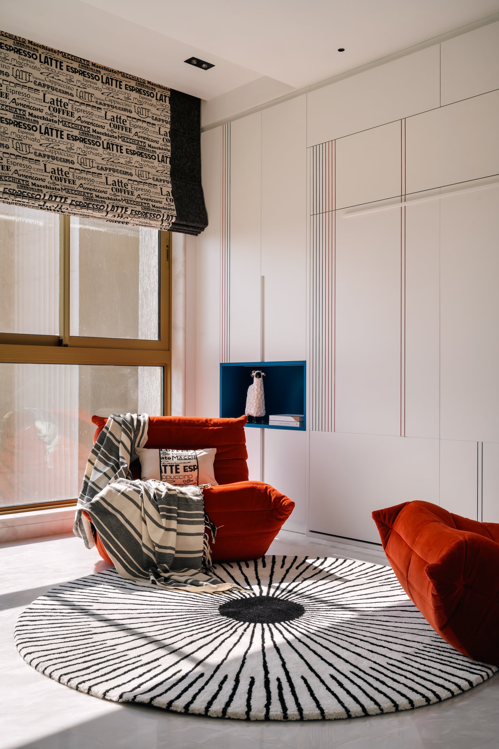 The parents' room takes restraint as its first principle, with fluted panels and mirrored insets setting a quiet rhythm