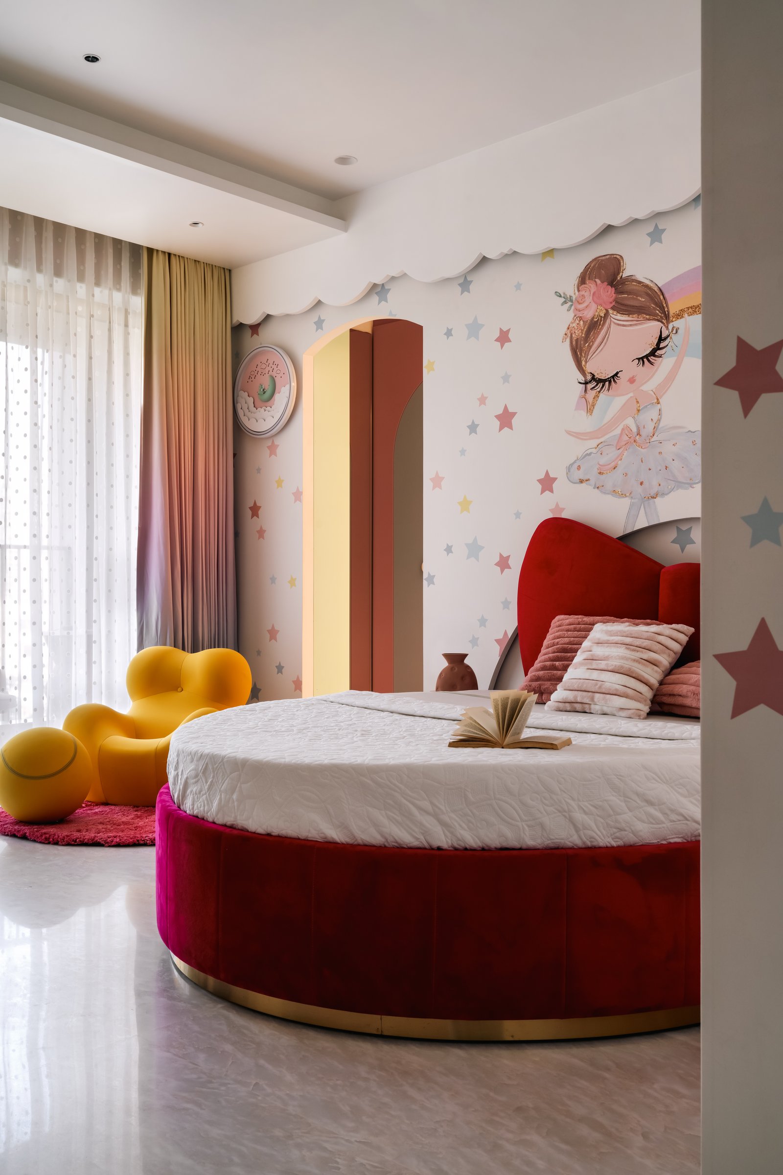 The daughter's room, where a fuchsia velvet bed with a sculpted bow headboard becomes the room's stage prop
