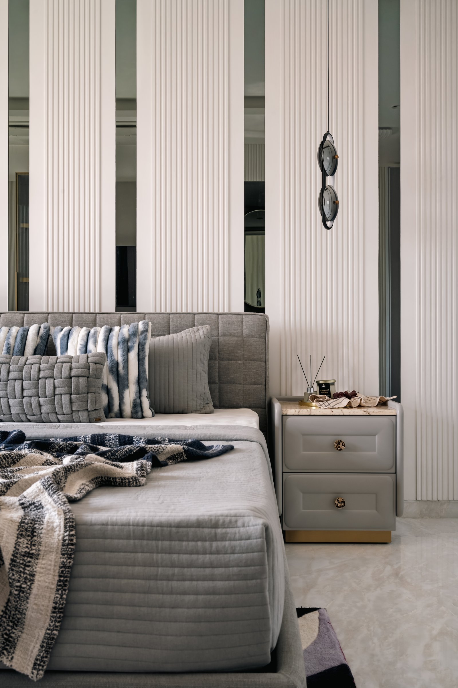 The multi-purpose room, where a Murphy bed and cobalt niches snap a neutral palette into focus