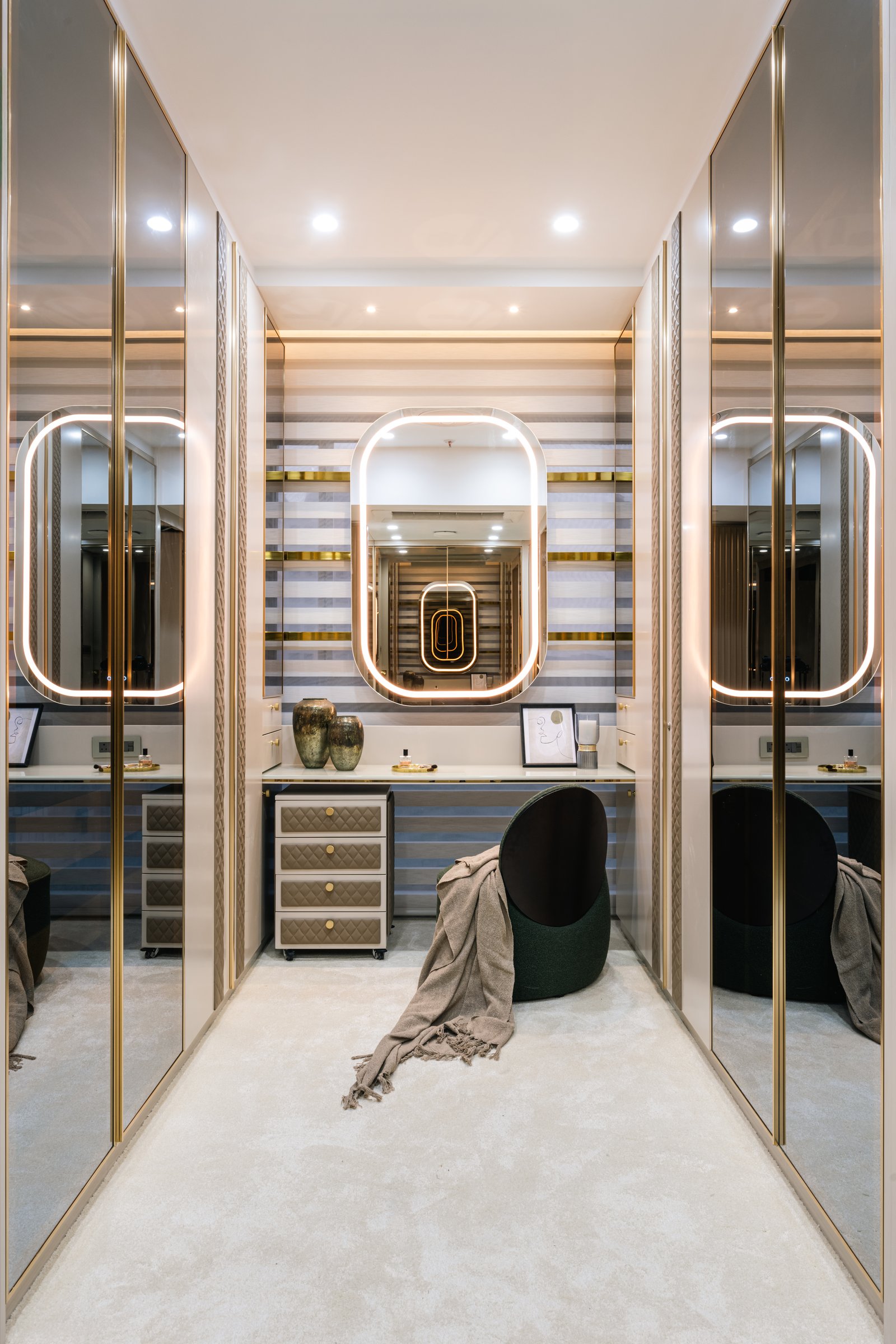 The master suite, anchored by a single slab of green quartzite veined with rust and cream
