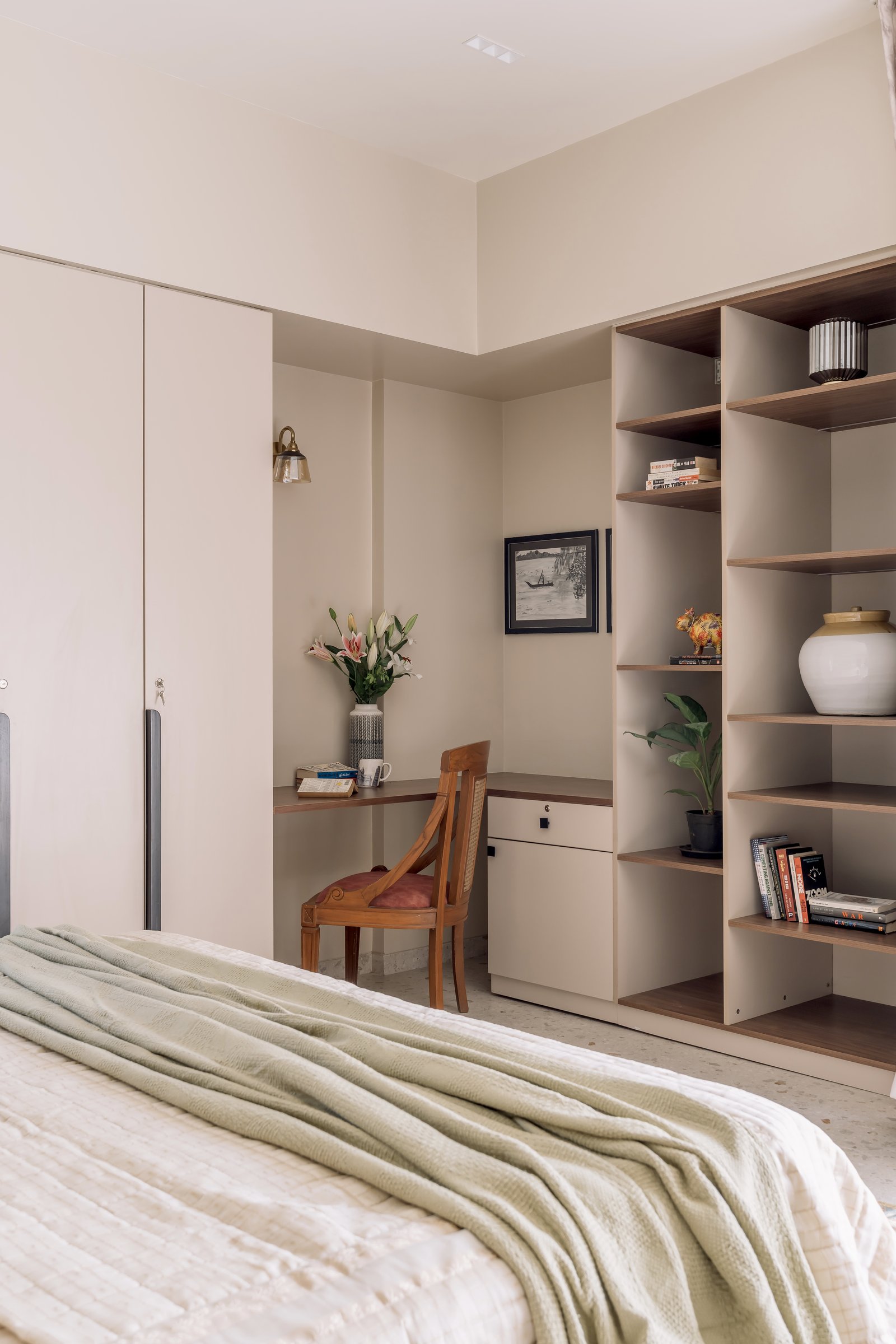 The study corner within the master bedroom, fitted between wardrobes and open shelves