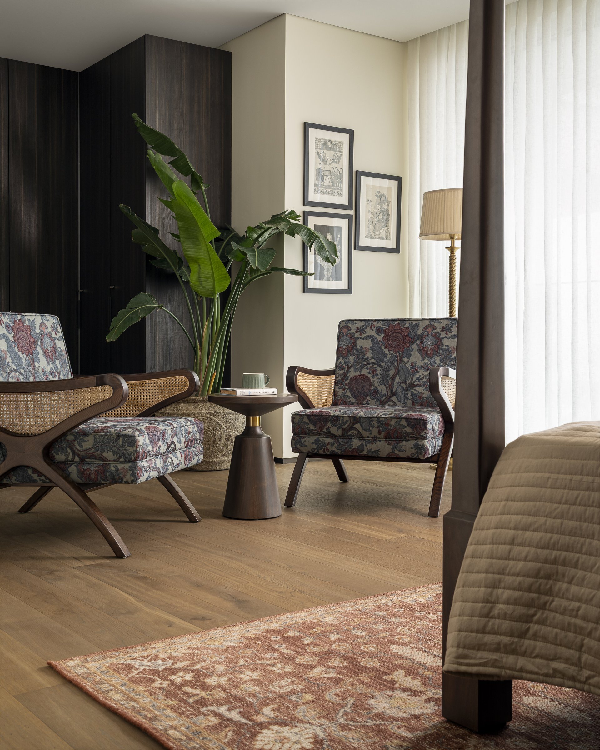 A seating corner within the master bedroom, given enough room to be used rather than only looked at