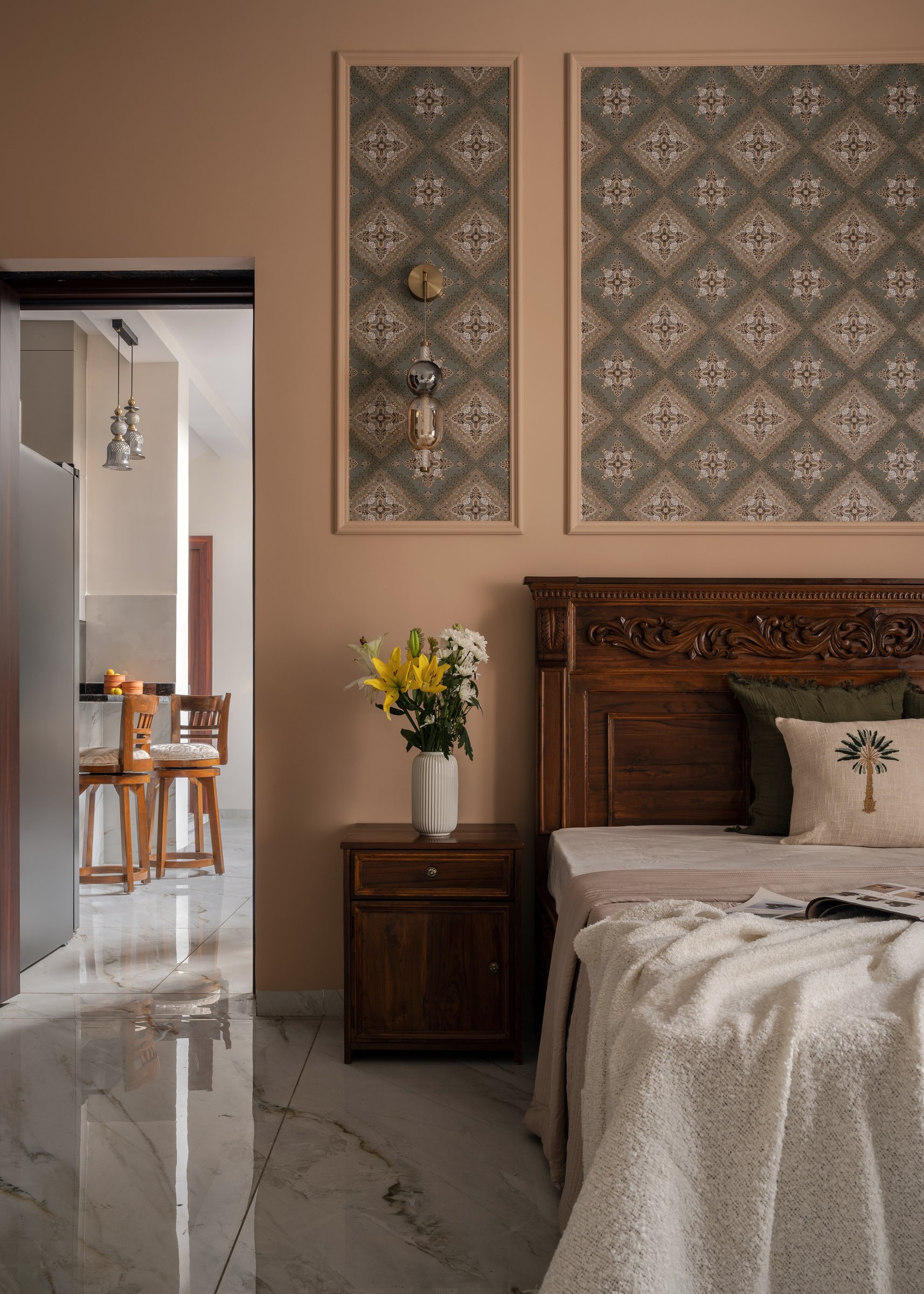 The master bedroom seen from the adjacent doorway, with a glimpse through to the kitchen bar beyond