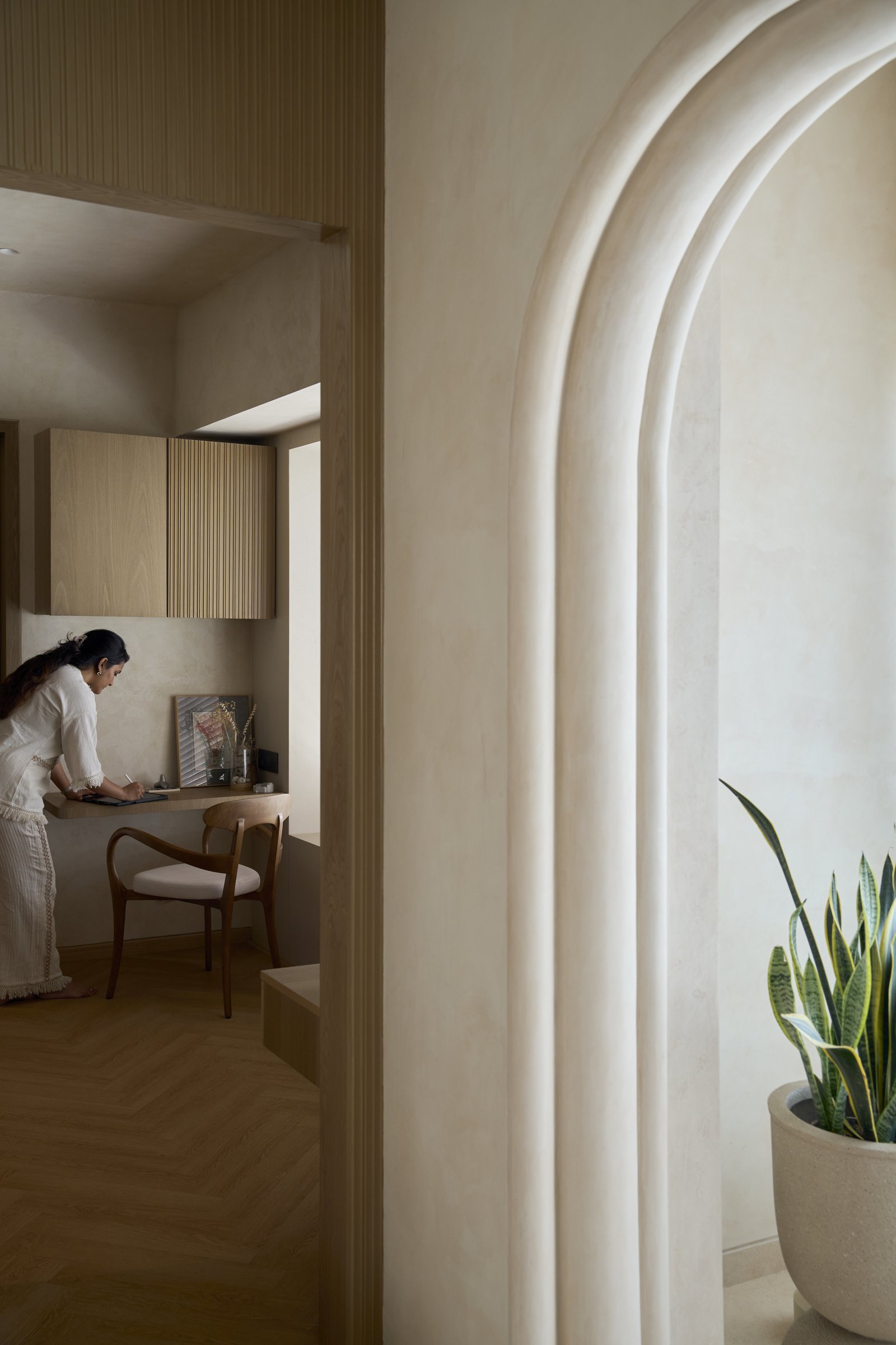 The study nook, tucked beneath a moulded plaster arch off the principal suite