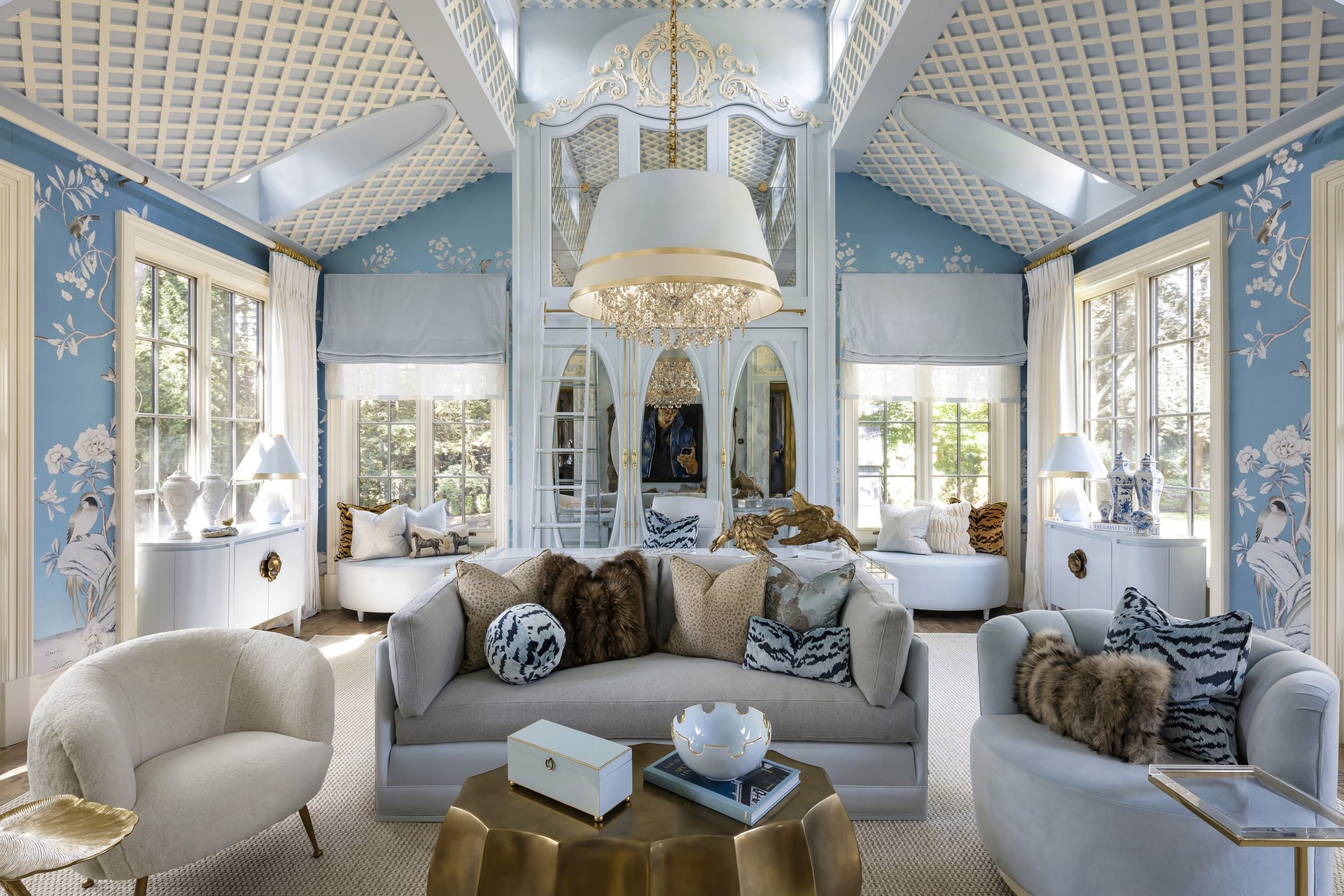 A layered living room where custom millwork, natural stone, and considered lighting build atmosphere through material depth