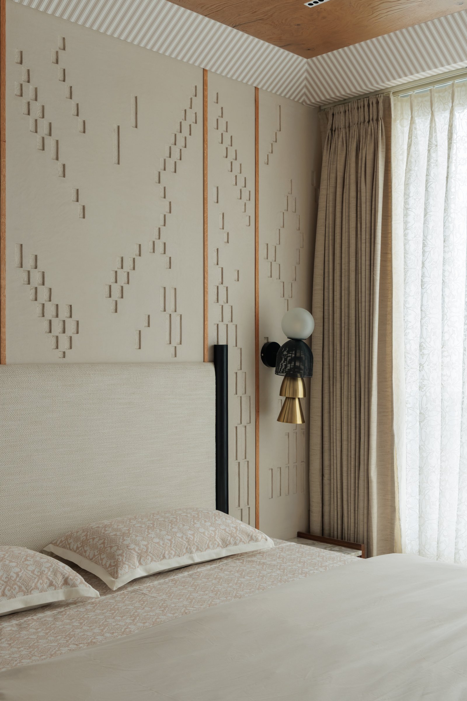 A closer look at the plaster relief, each raised module hand-set into a quiet geometry