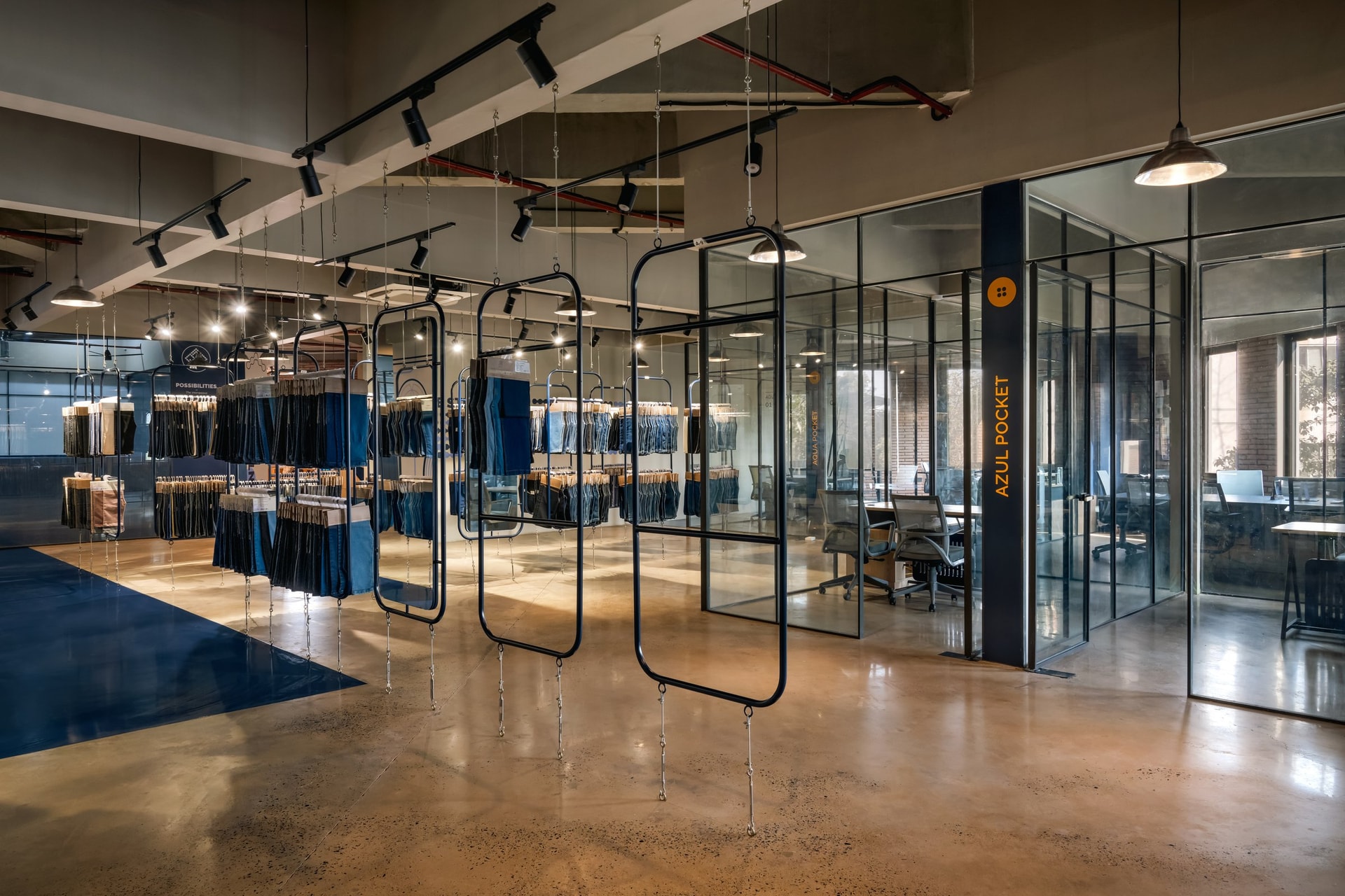 The threshold between the central gallery and the office periphery, where the forty-five-degree rotation produces its characteristic diagonal cuts between materials