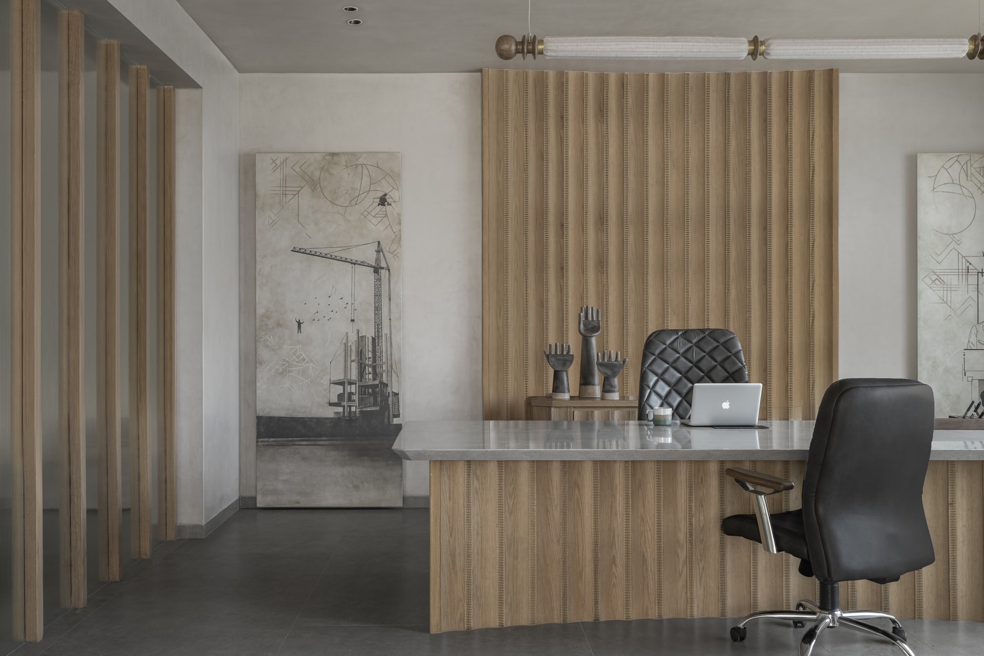The principal cabin, where a channelled wooden desk and large-scale conceptual artworks define the room's character
