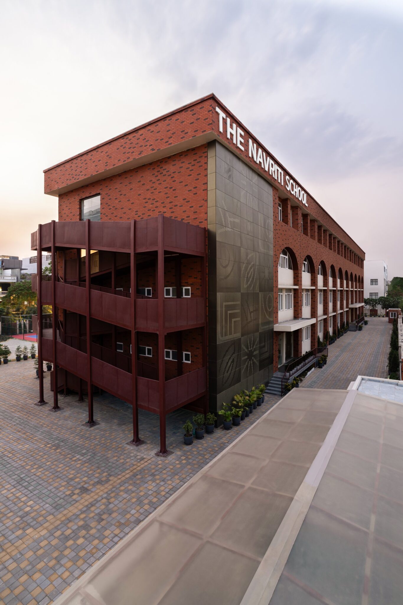 The Navriti School: A Campus Defined by Circles, Arches and Deep Red — Navya And A Quarter, DLF Phase IV, Gurugram, Haryana
