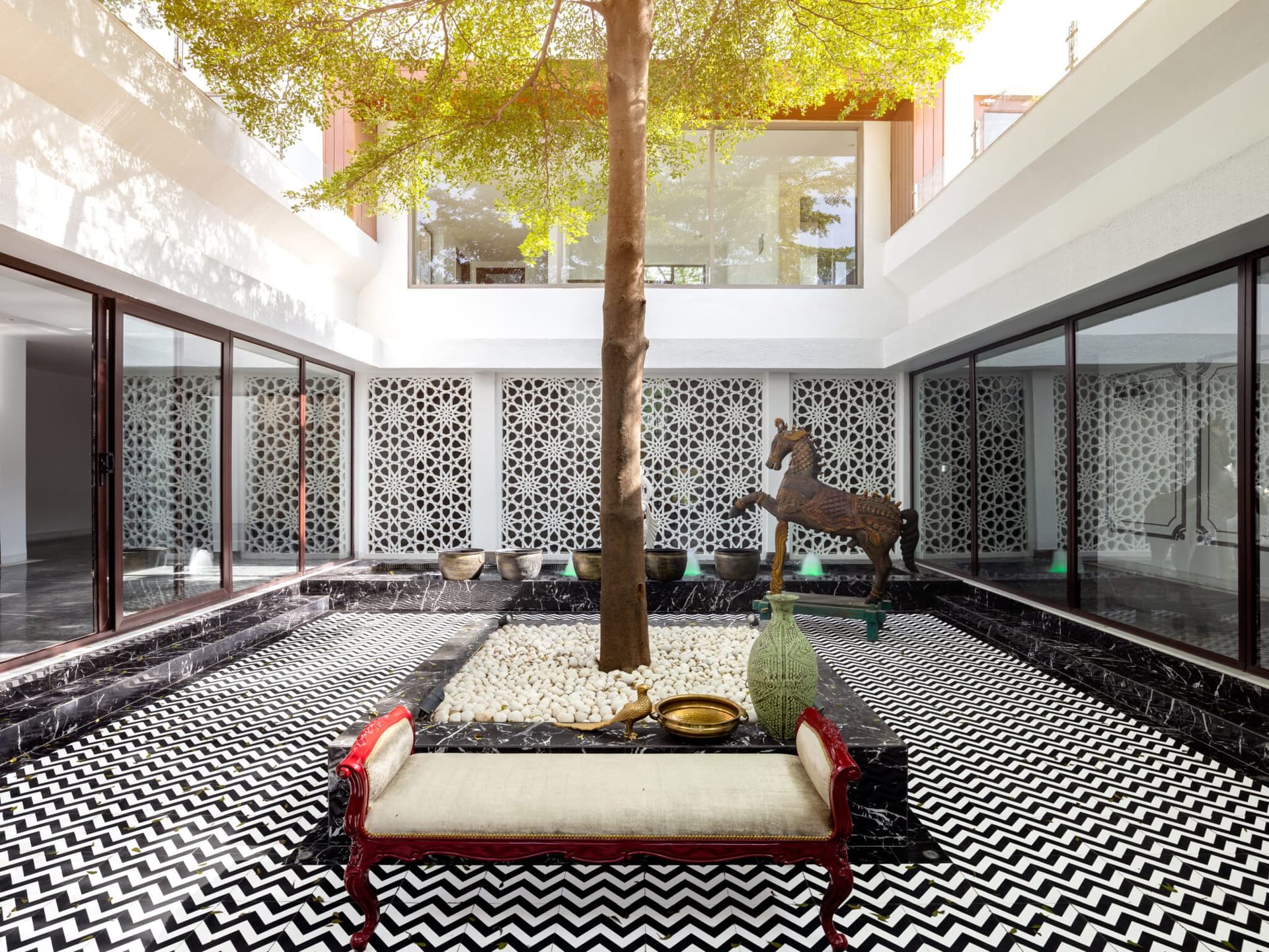 A harmonious confluence of styles and elements articulate grandeur in this luxurious abode by Altus Luxury Living — interior design by Altus Luxury Living in Chattarpur, New Delhi