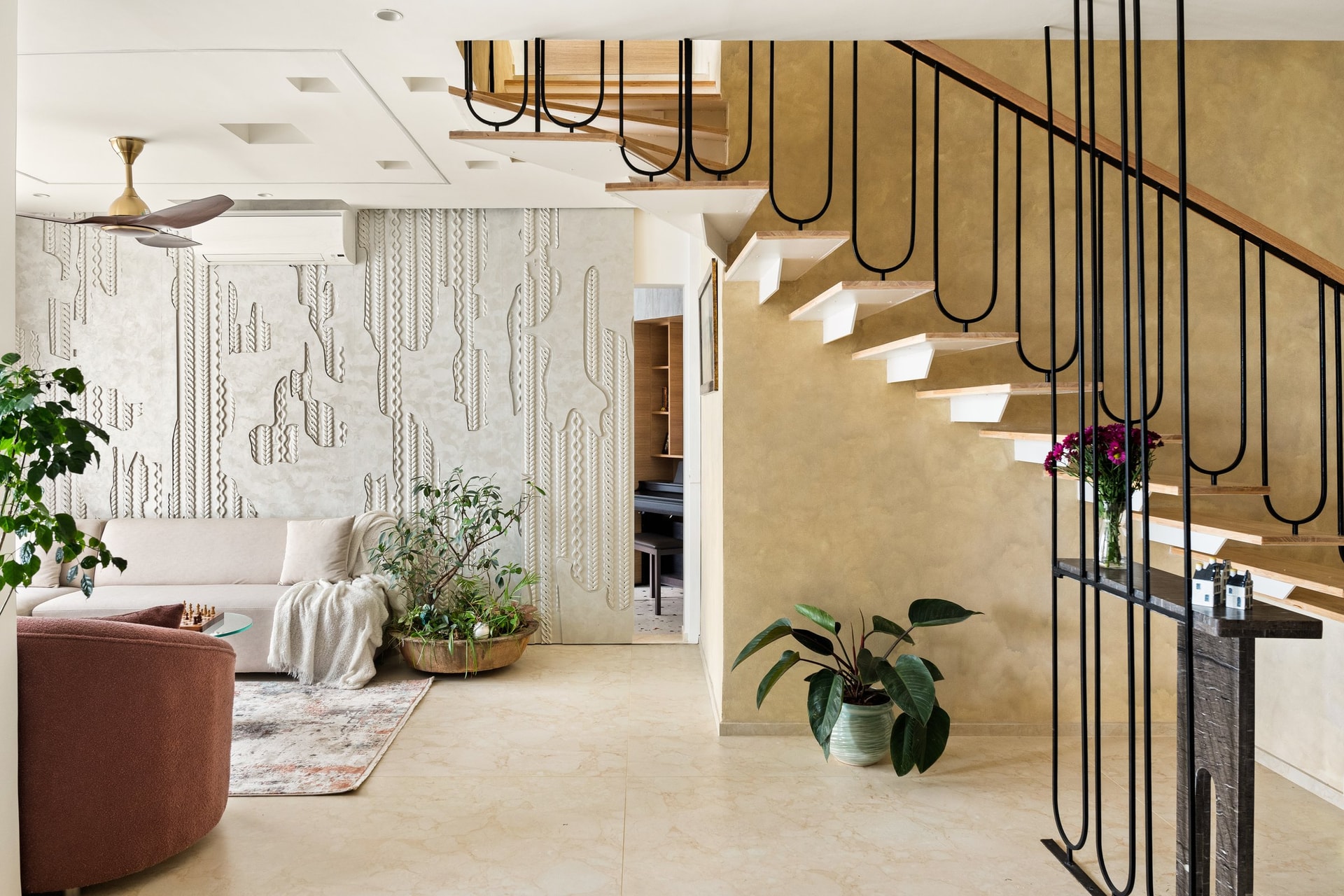 The sculpted floating staircase: the project's clearest piece of design writing, drawn in line rather than mass