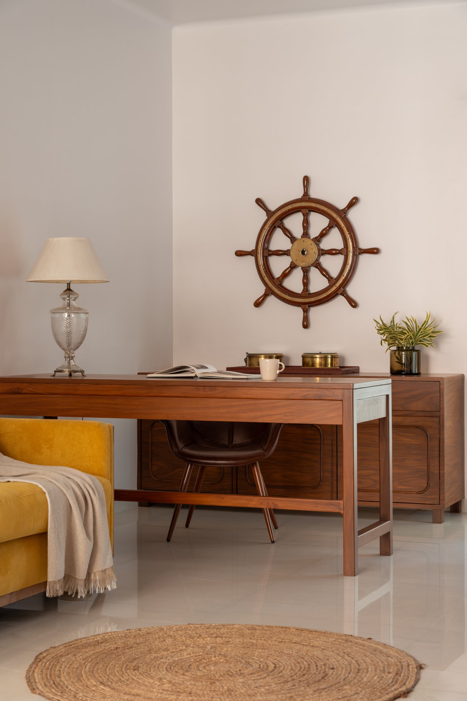 The study, where a ship's wheel and solid timber desk declare the homeowner's interests without apology