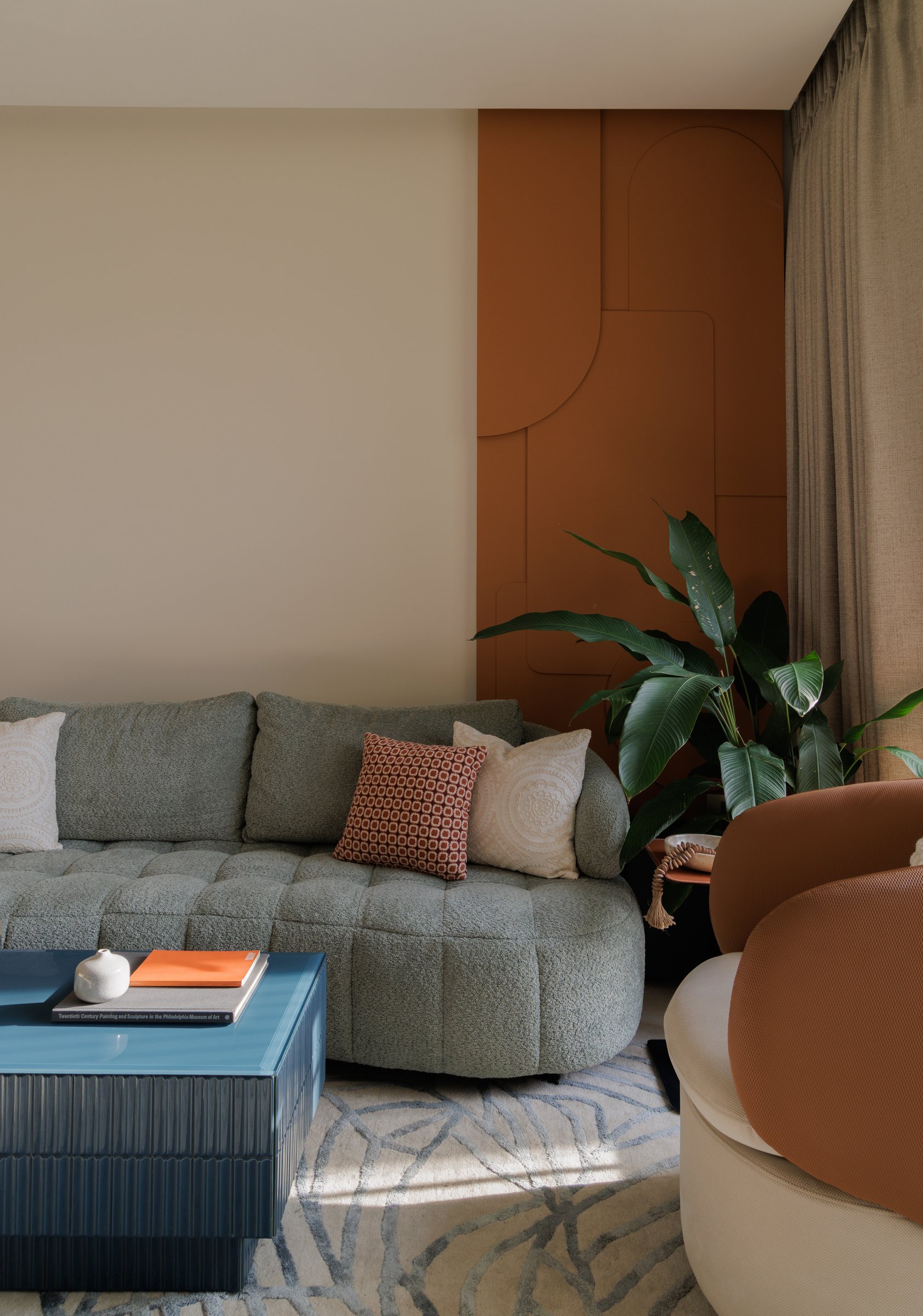 A closer look at the sienna relief panel, the home's clearest design thesis in a single composition