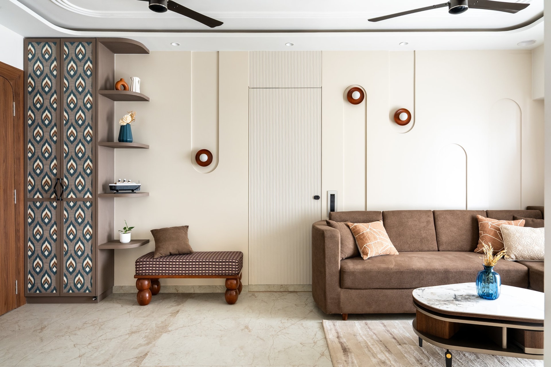 An ikat-panelled storage column and a checkered ottoman on turned legs introduce the home's one moment of overt pattern