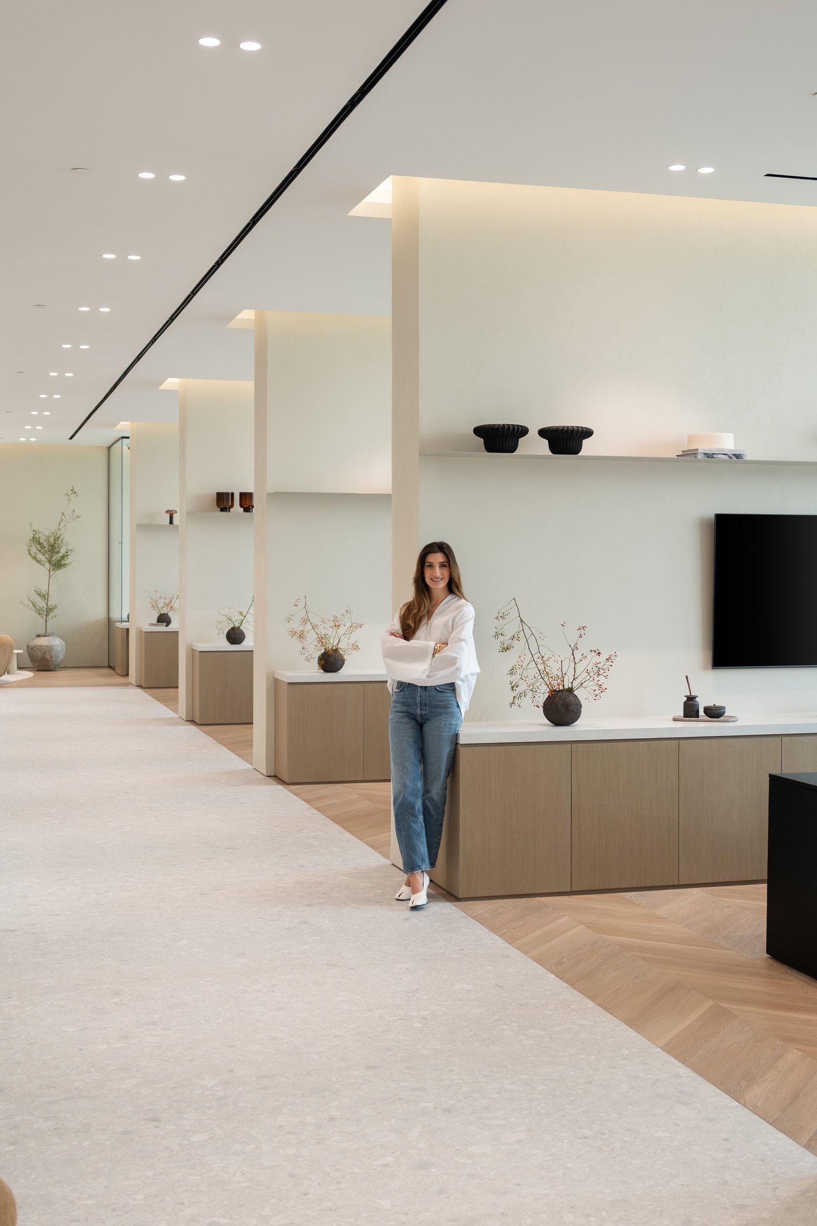 Designer Jessica Khouzami within the display gallery, where empty space is the discipline that lets a single object matter