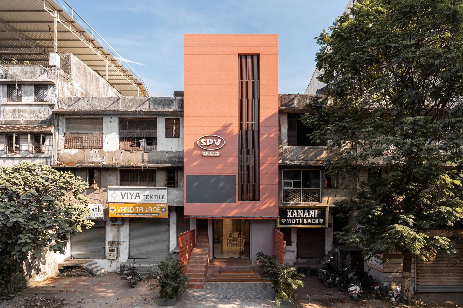 The facade reads against its working-street context without mimicry or shout