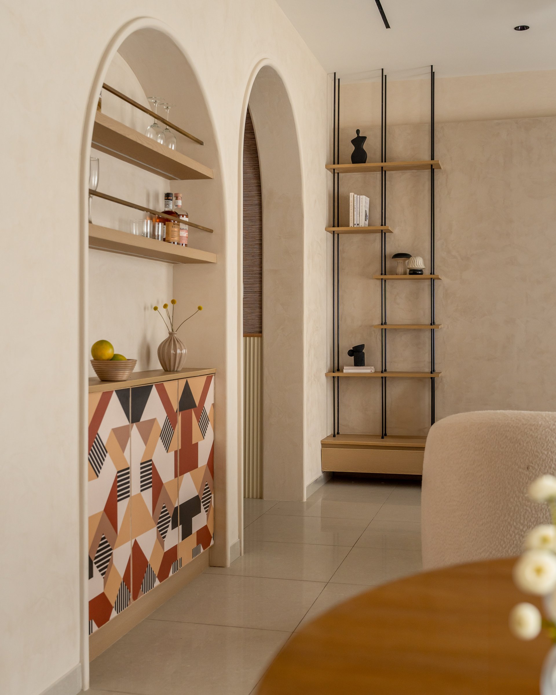 The bar alcove and the arched passage beyond: where Yugen lets play surface against its neutral script