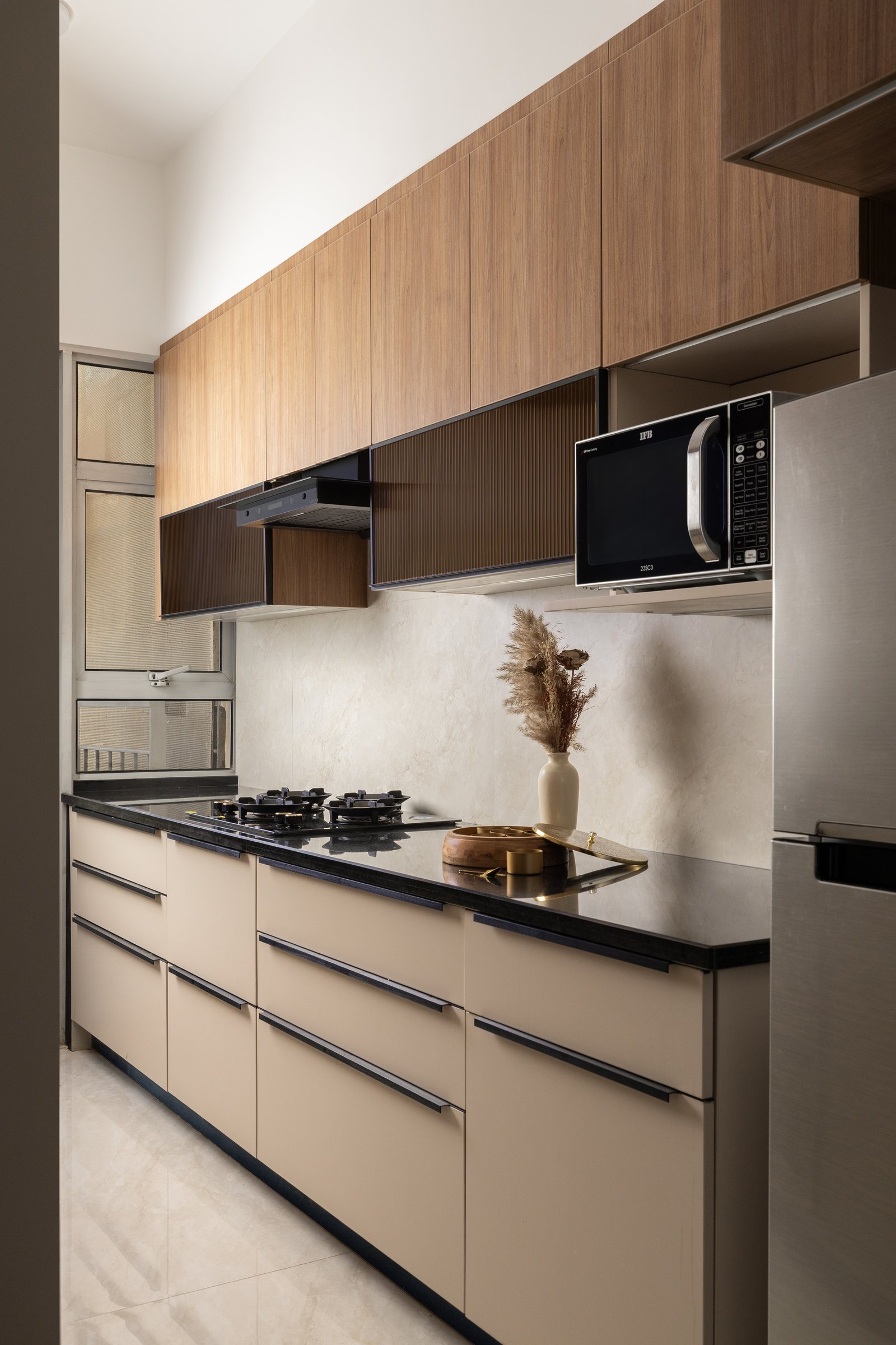 The kitchen, compact and pragmatic, kept deliberately quieter than the public rooms