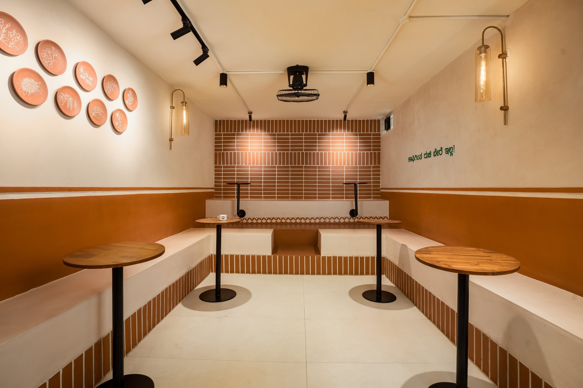 The U-shaped seating arrangement, which gathers strangers into a small communal pit