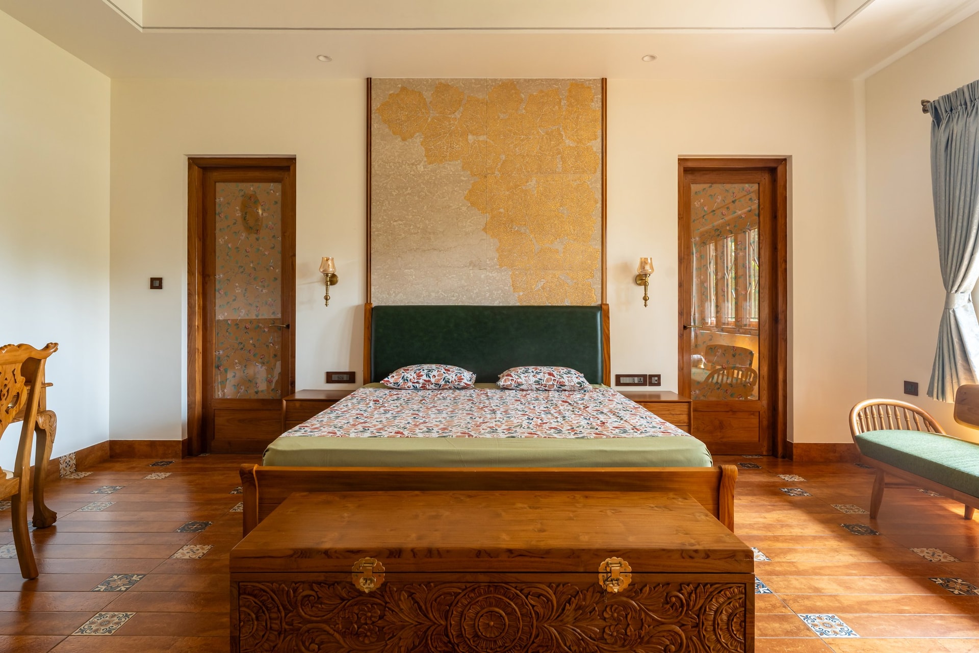 The master bedroom, where pressed leaves from the site are embedded into a stone-toned headboard wall