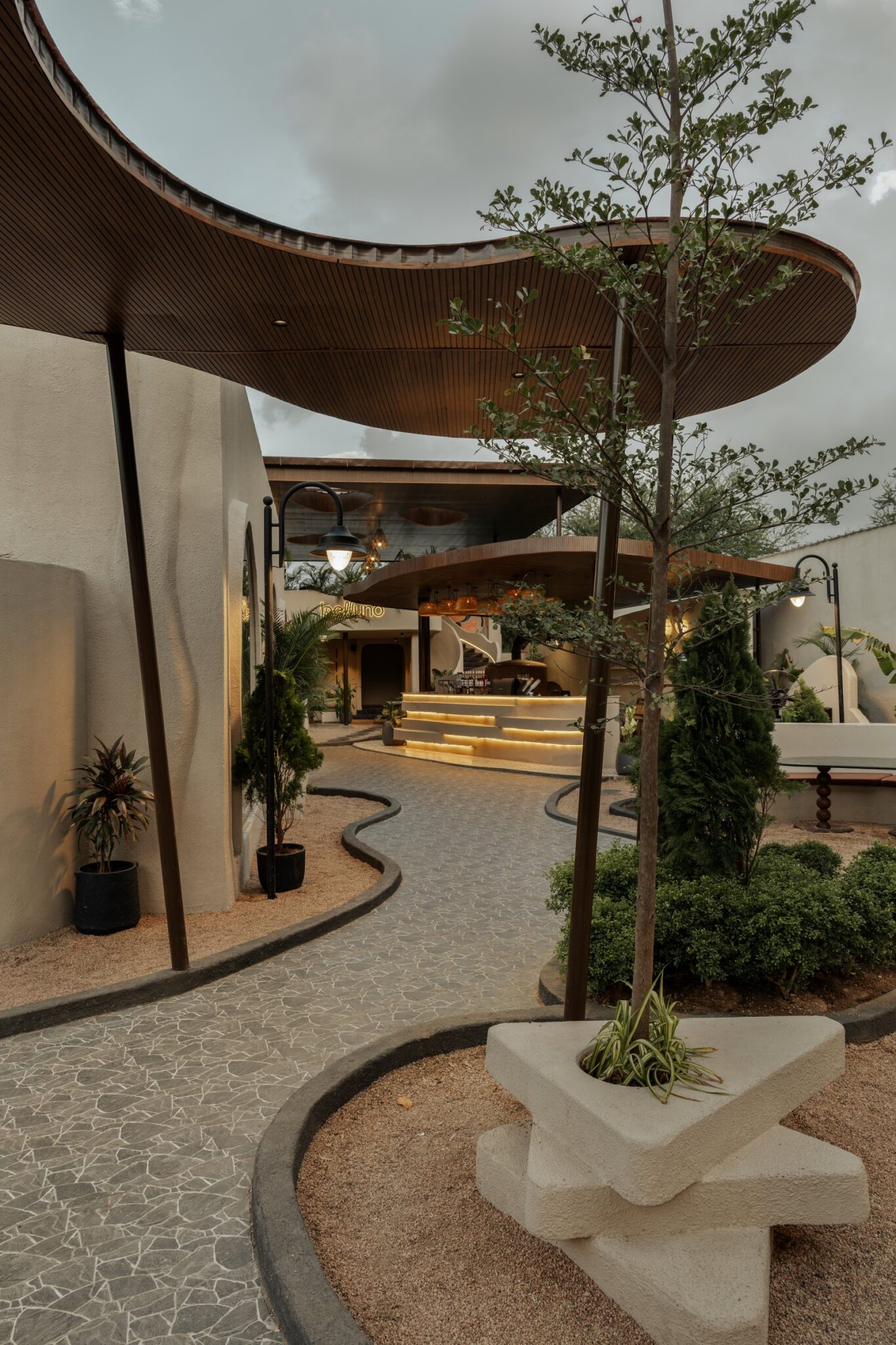 Belluno: A Surat Café Where Curves, Earth, and Greenery Set the Pace — Architation, Surat, Gujarat